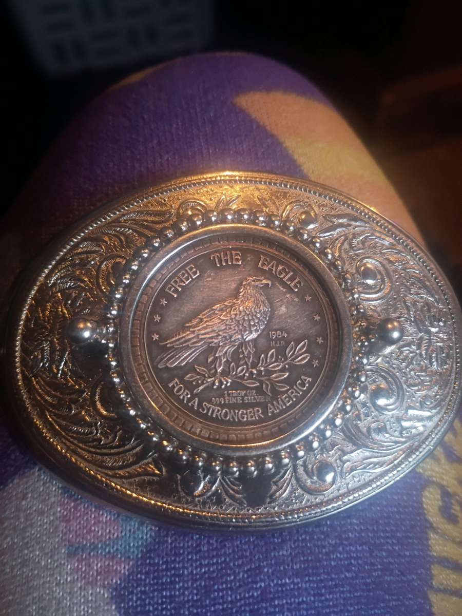 belt buckle with silver coin in the middle