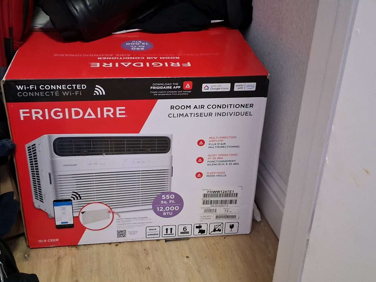 A brand new never used refrigerator and a brand new wifi AC