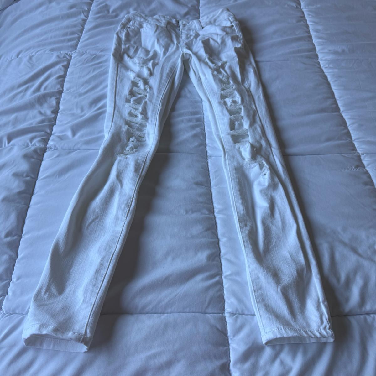 Pair of WAX JEANS white distressed skinny jeans made in USA