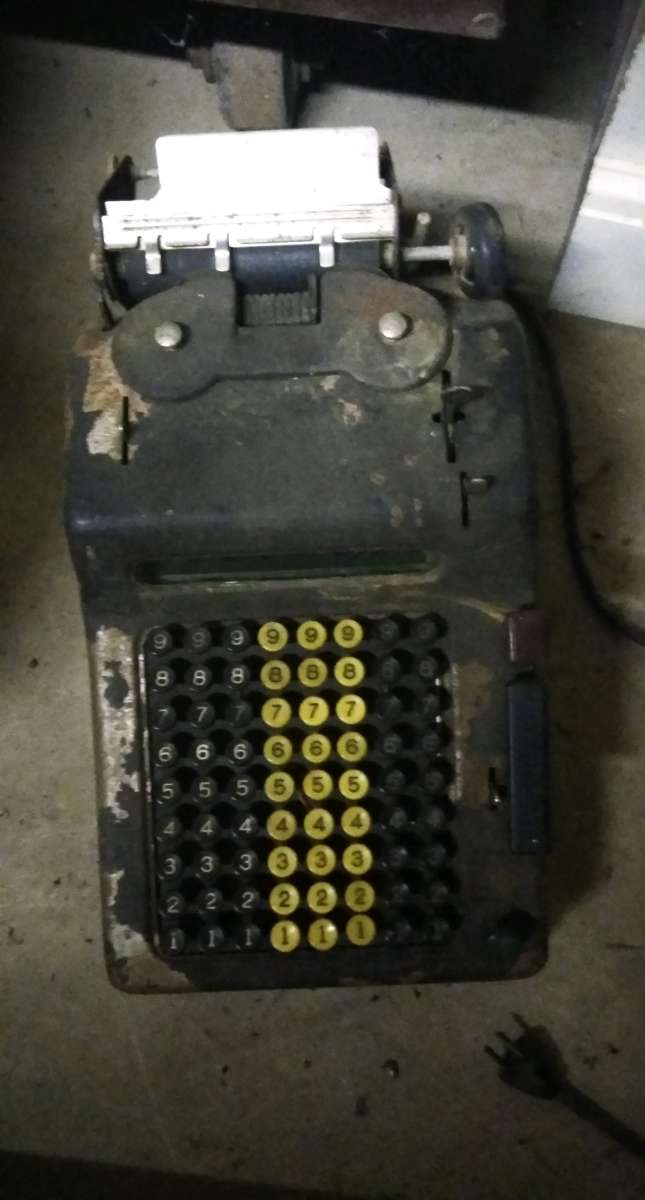 Antique adding machine