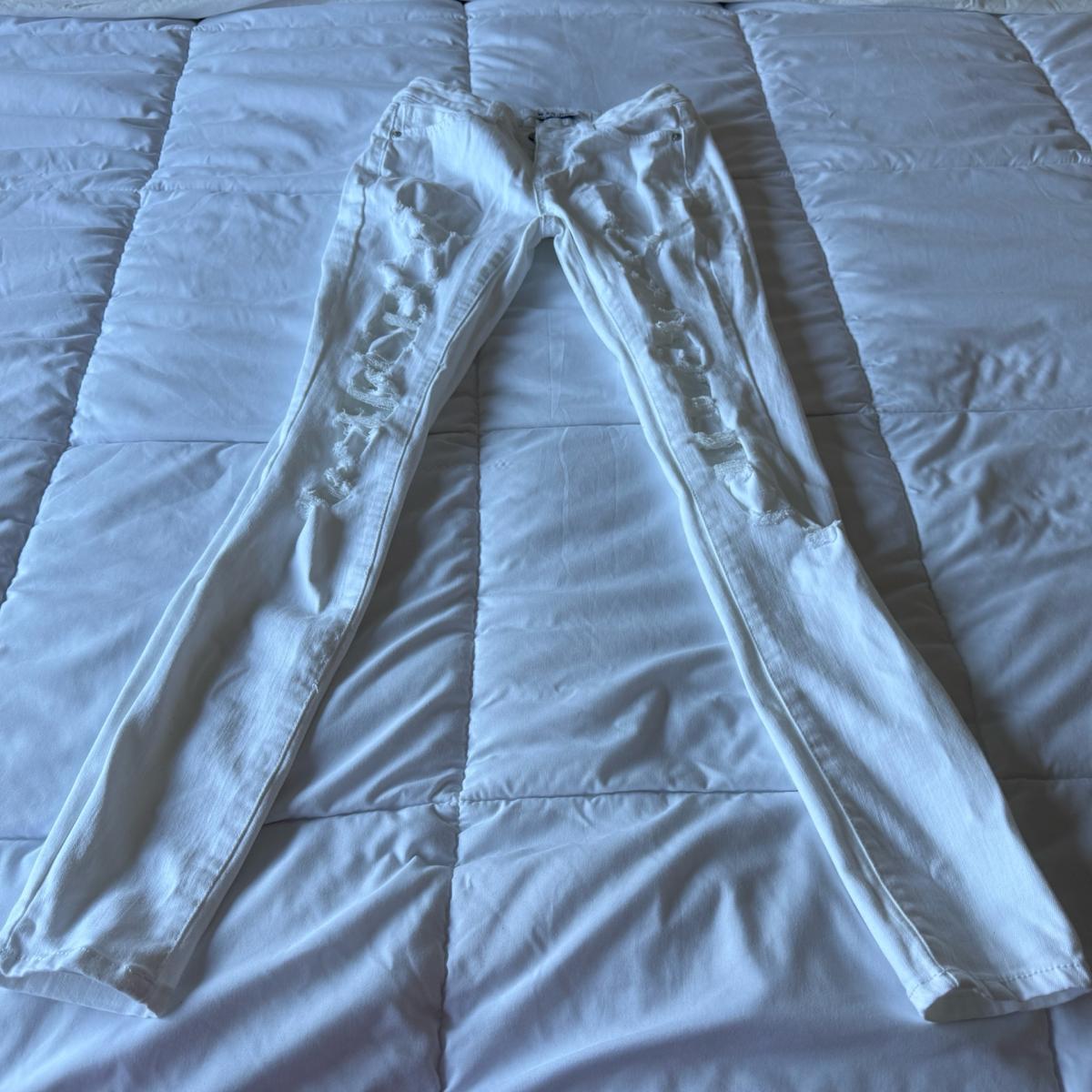 Pair of WAX JEANS white distressed skinny jeans made in USA