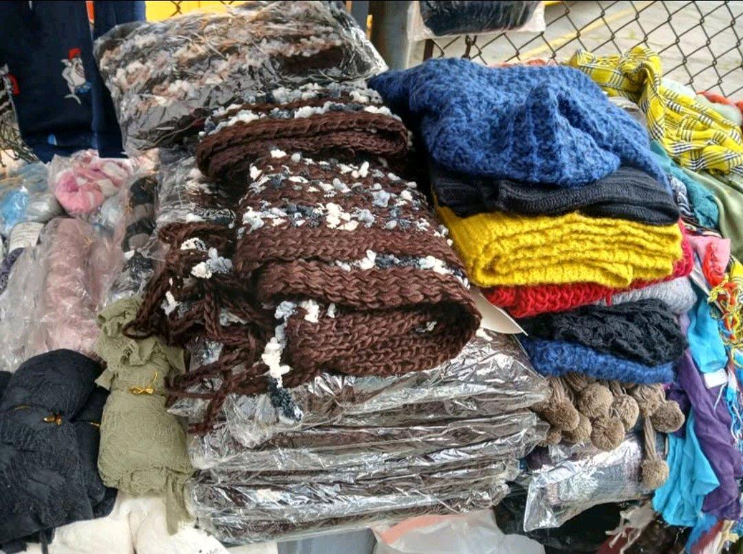 Tons of scarfs toys ect selling evrything shown