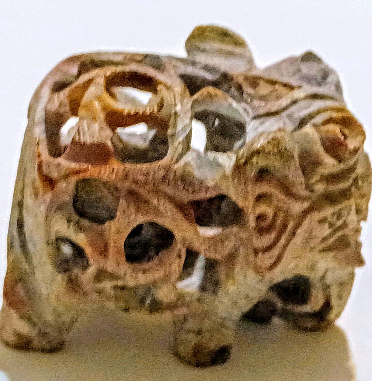 two soap stone elephant with baby elephant inside them