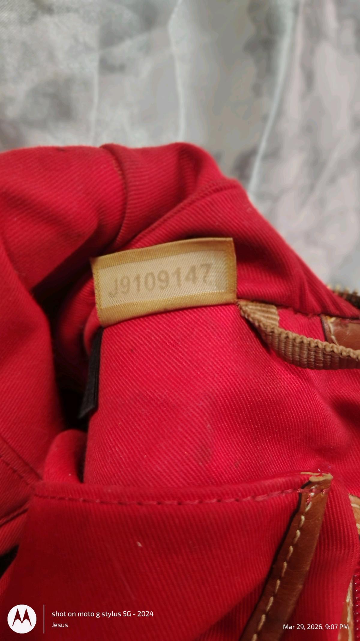 Dooney and Burke black purse with red in lining