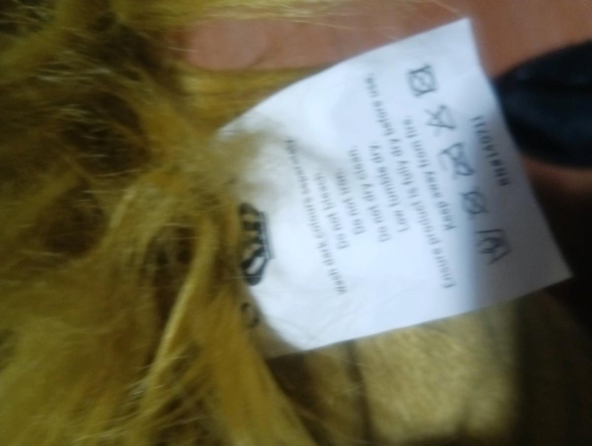 a golden fluffy pillow brand new never been used never been