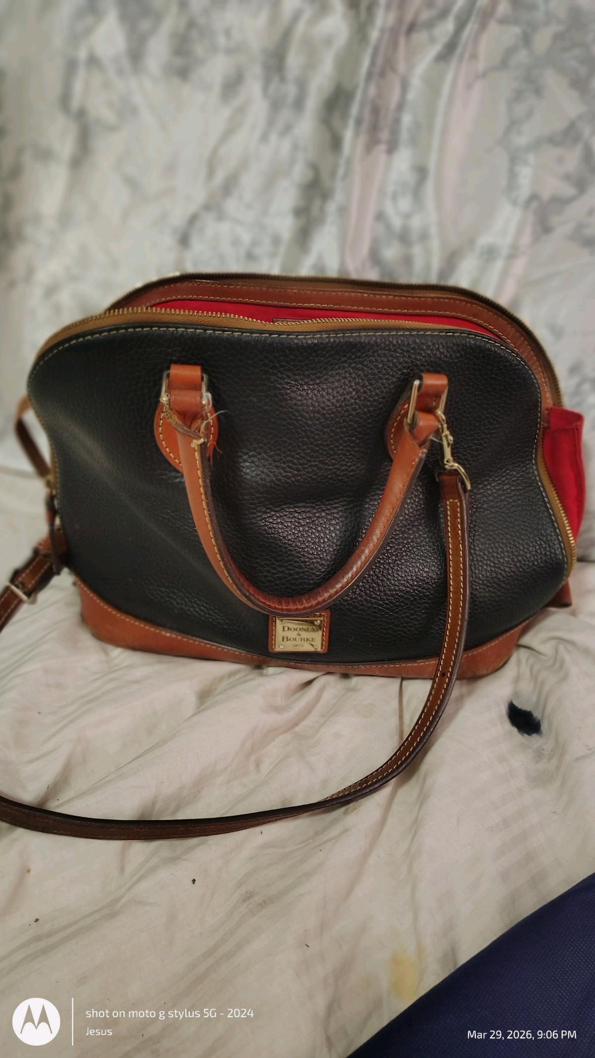 Dooney and Burke black purse with red in lining