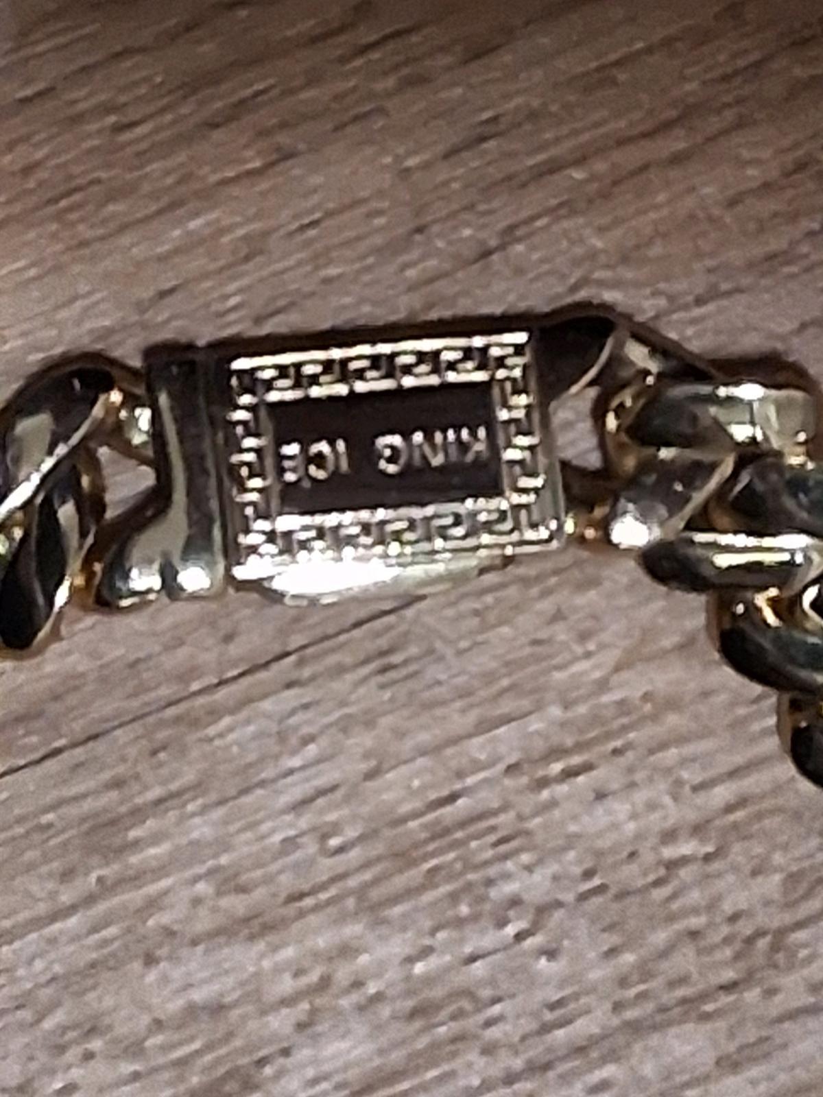 Double side of the chain gold in back and dimons in front