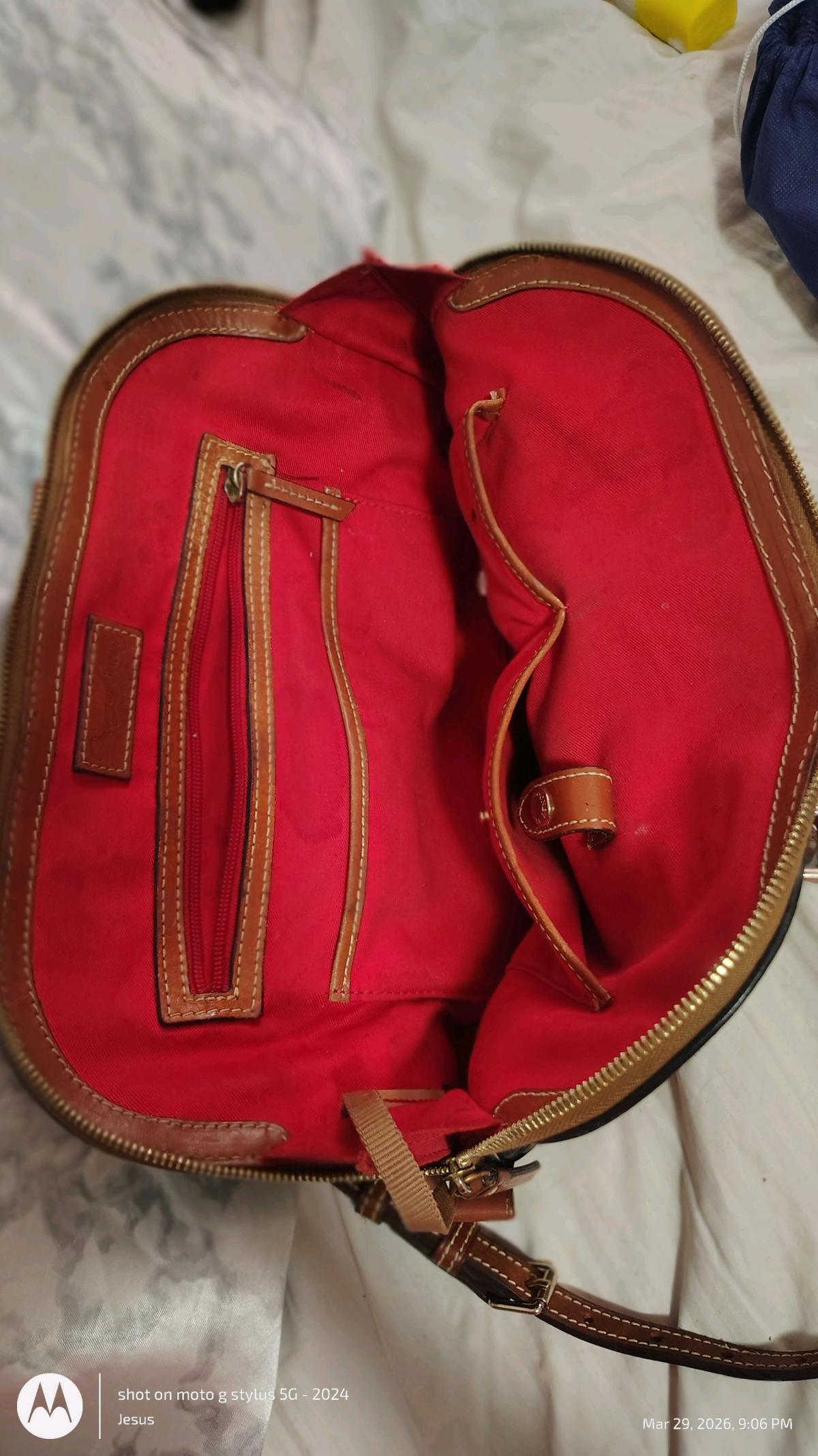 Dooney and Burke black purse with red in lining