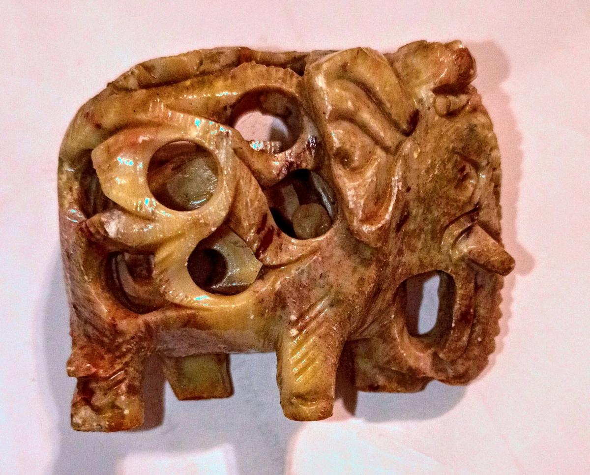 two soap stone elephant with baby elephant inside them