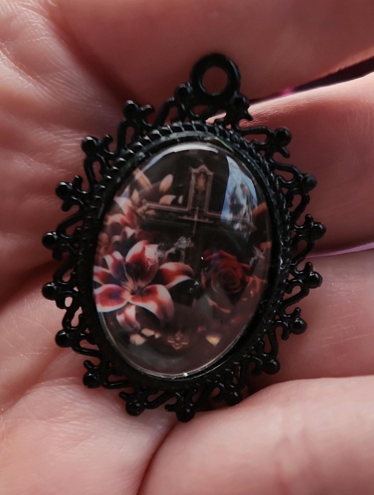 Cross n flowers in black pendant