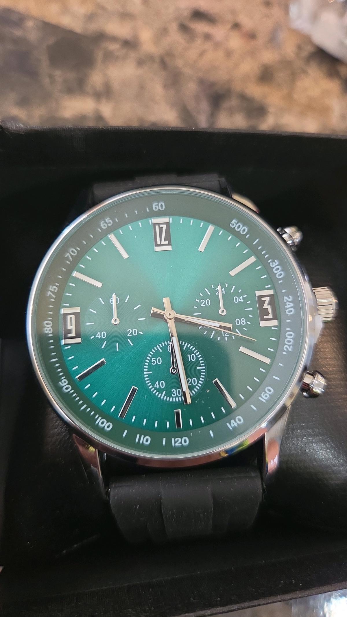 watch with green dial