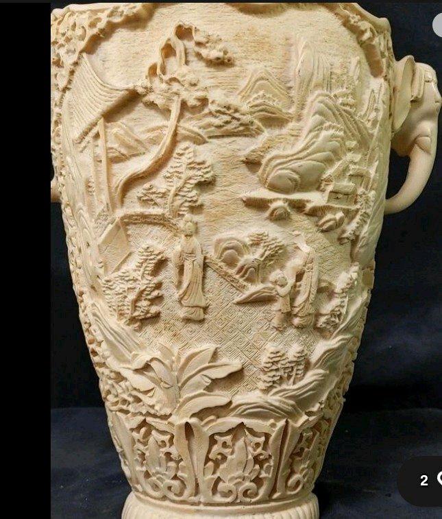 Chinese style collectible vase with 3D carvings of life