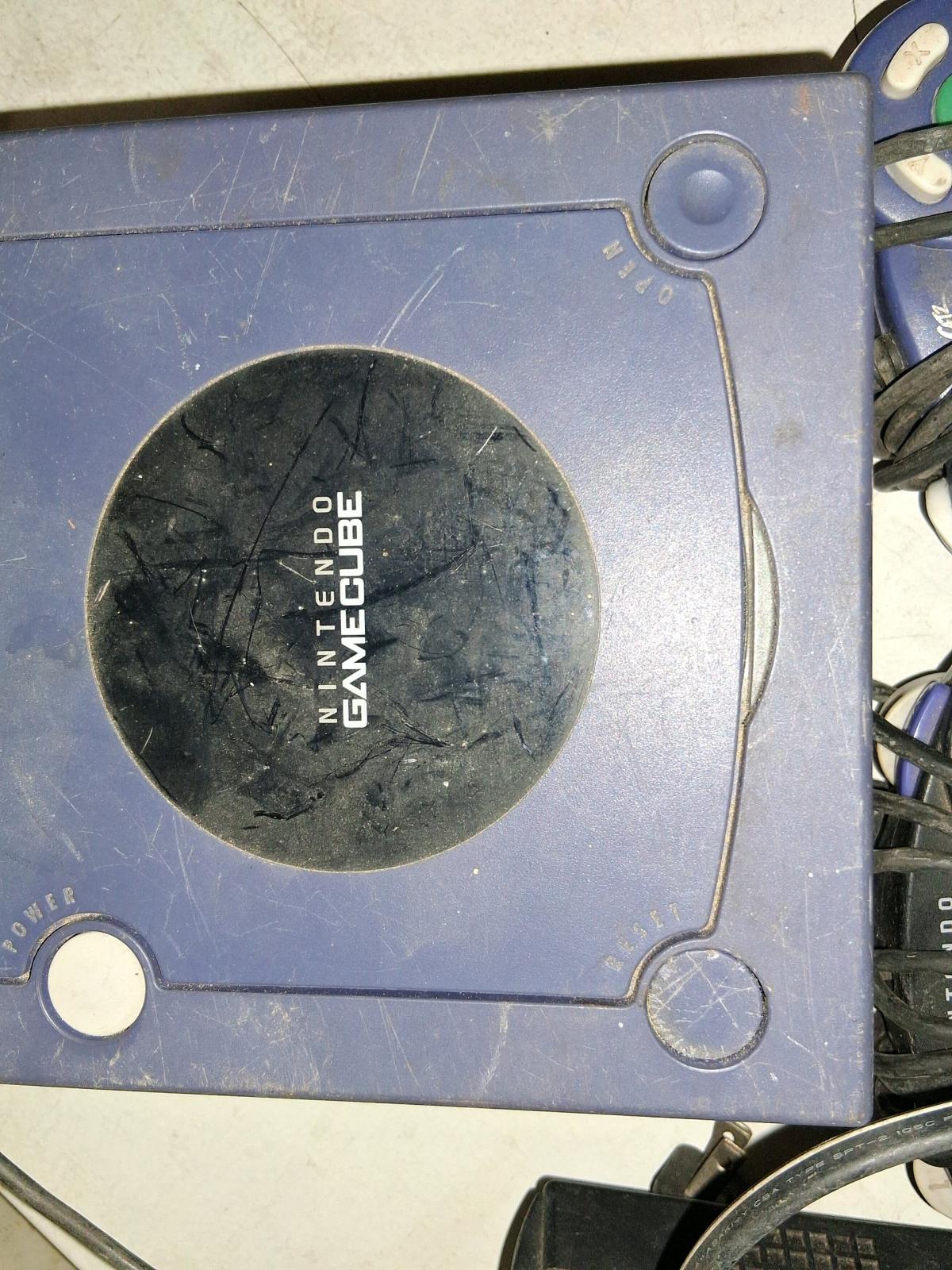 gamecube and 4 controllers