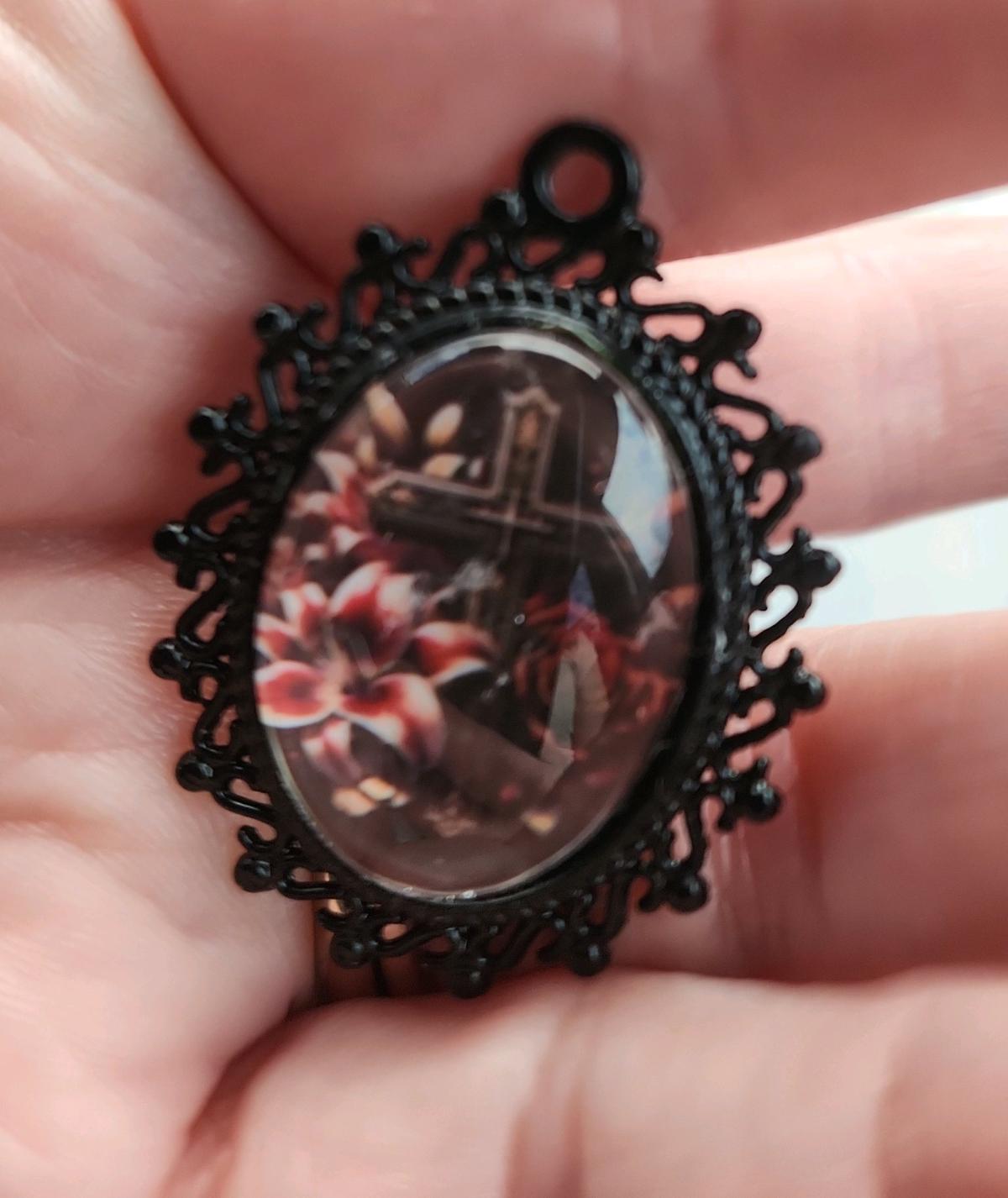 Cross n flowers in black pendant
