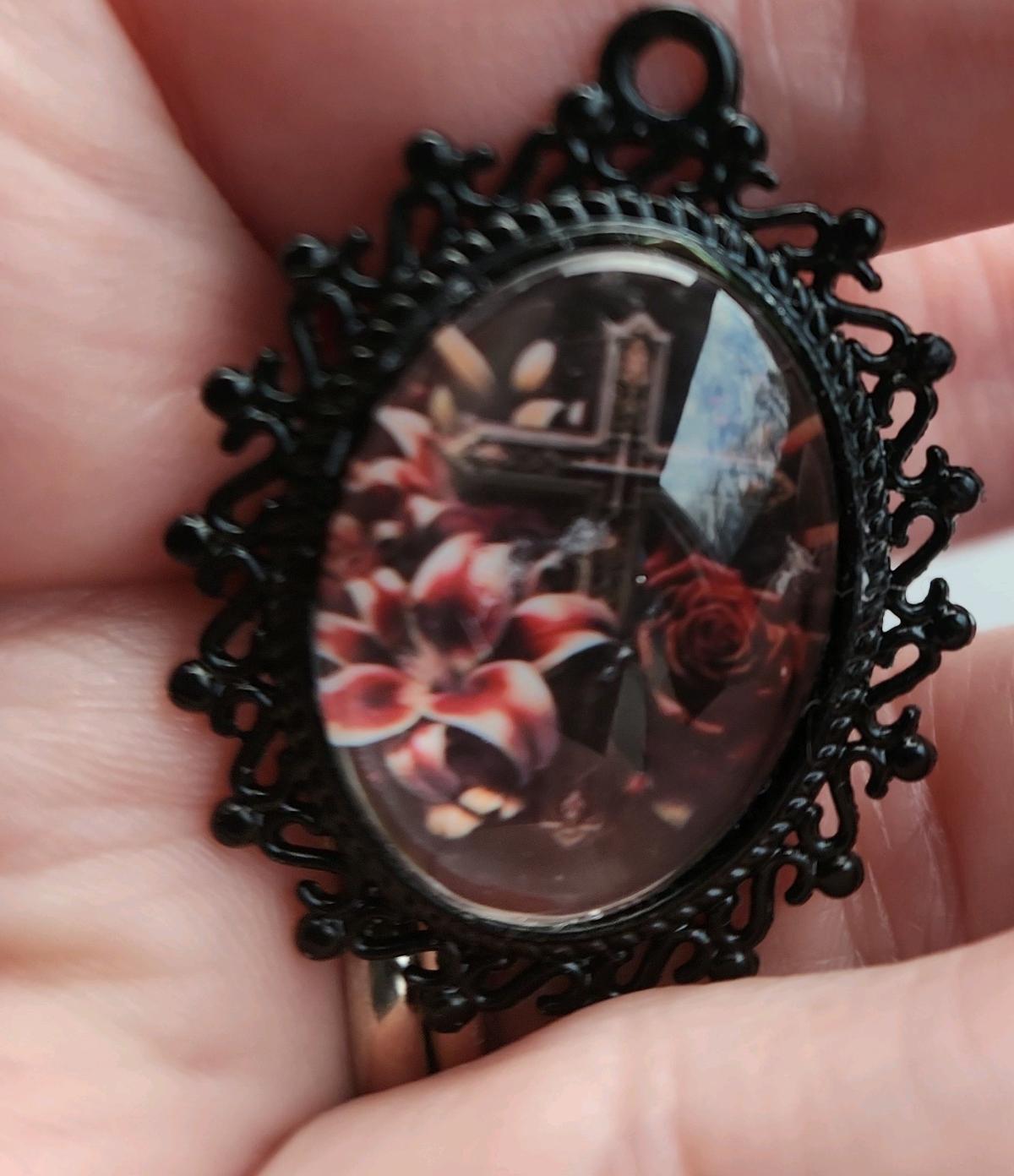 Cross n flowers in black pendant