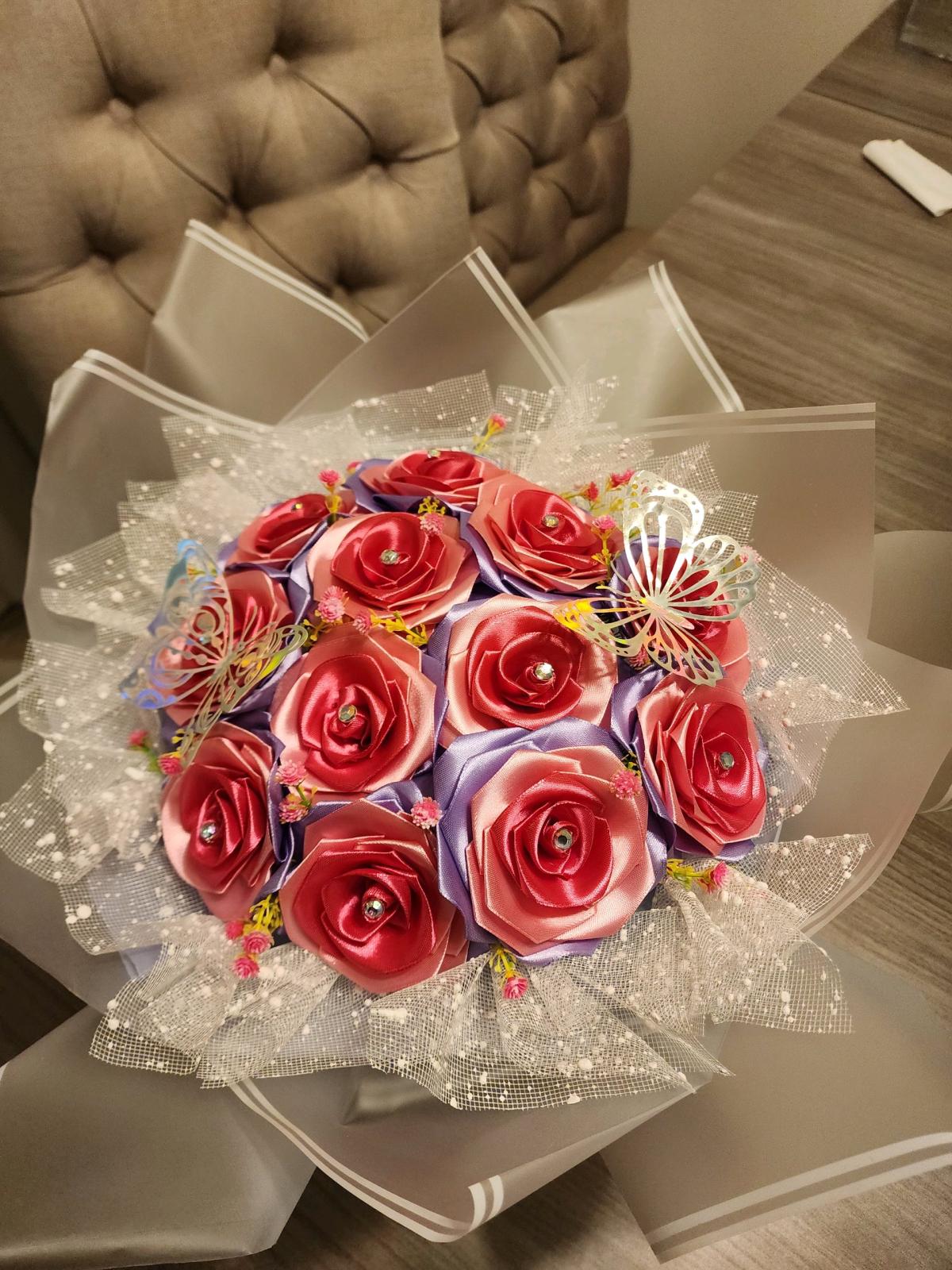 Pink and lavender satin ribbons roses bouquet