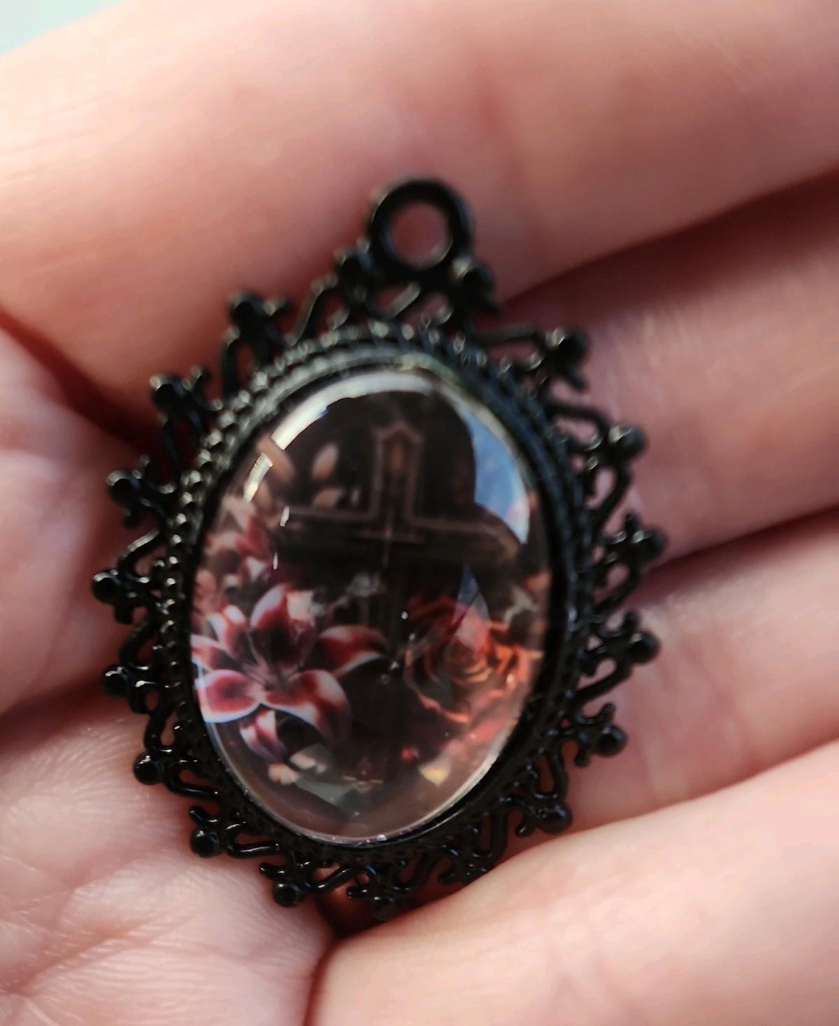 Cross n flowers in black pendant