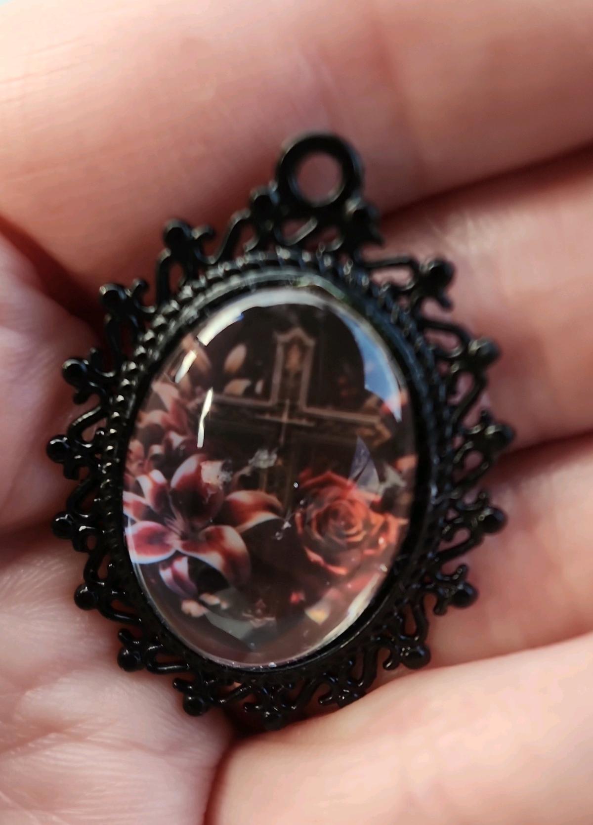 Cross n flowers in black pendant
