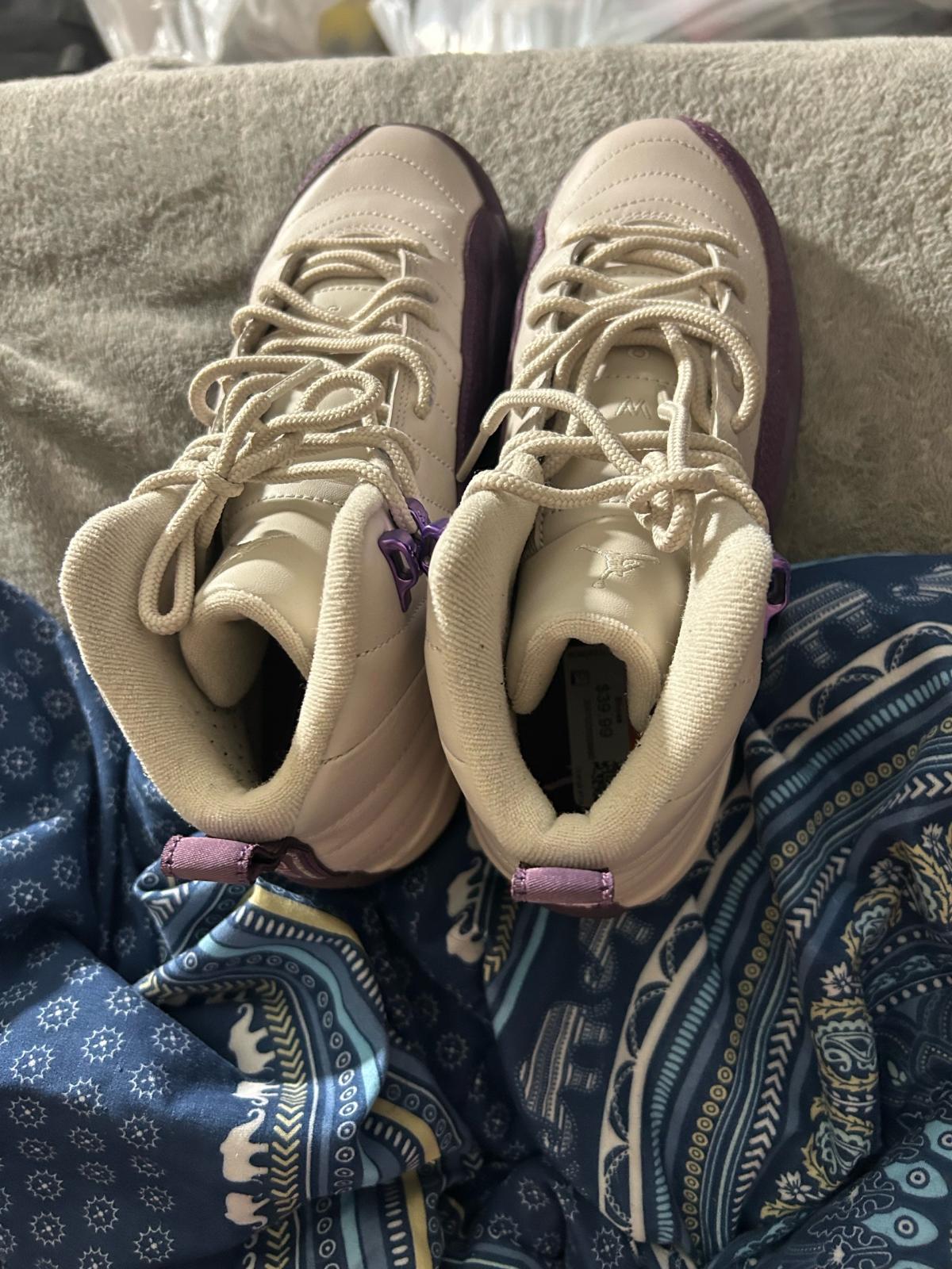 purple and white Jordans