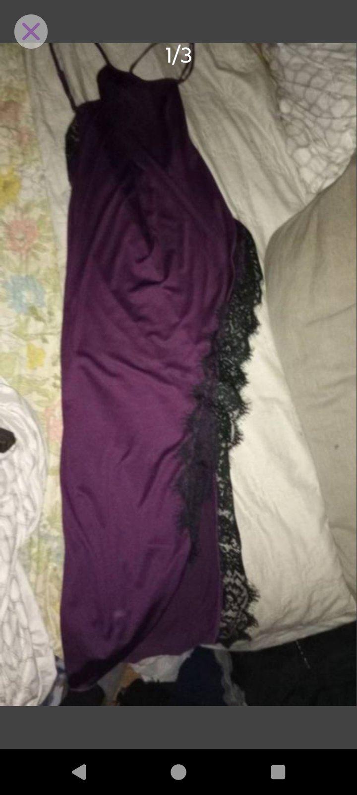 A Sexy Womans Purple and Black Lingerie Outfit