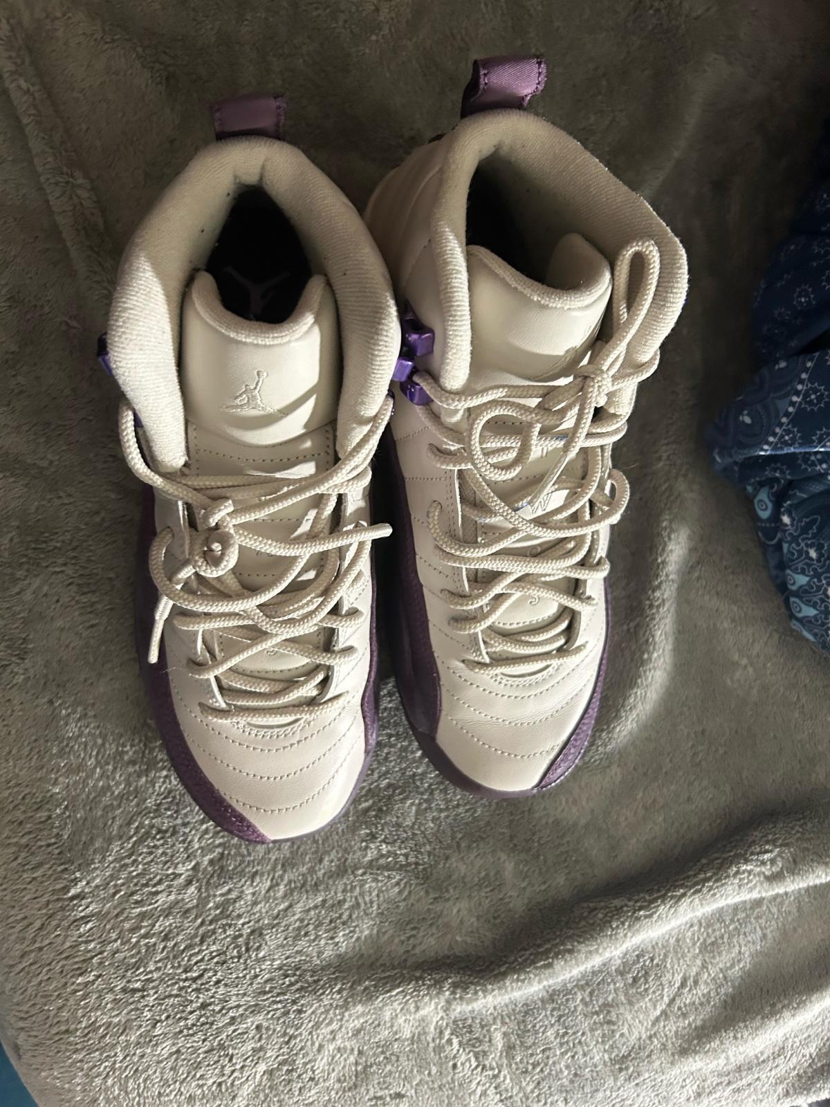 purple and white Jordans