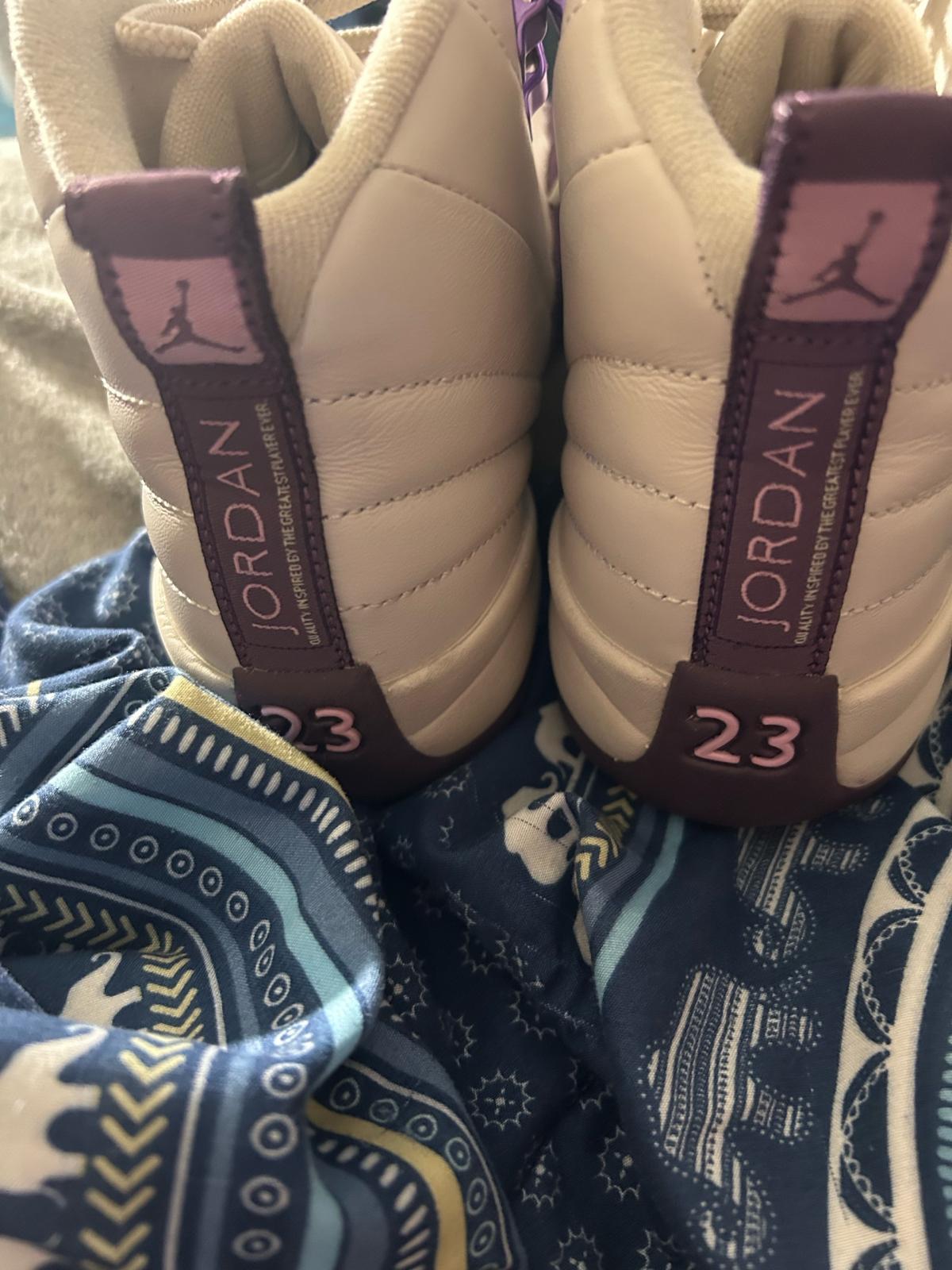 purple and white Jordans