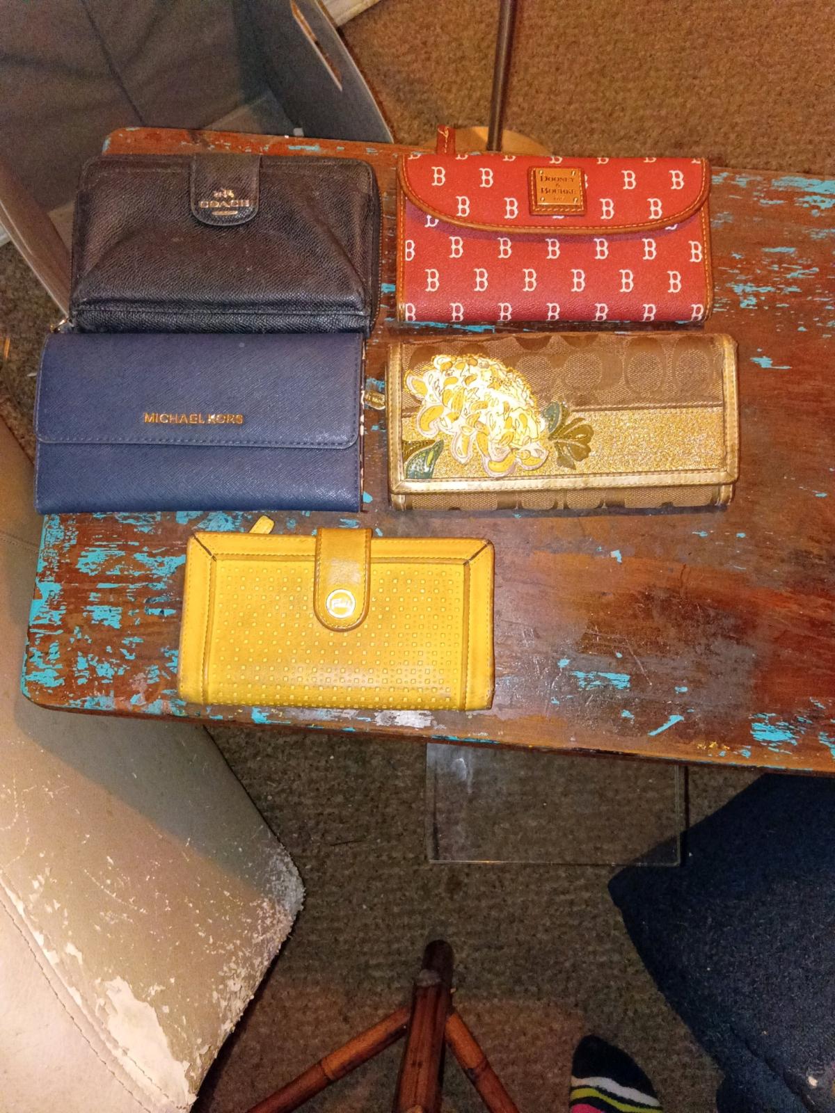 assorted womens name brand wallets