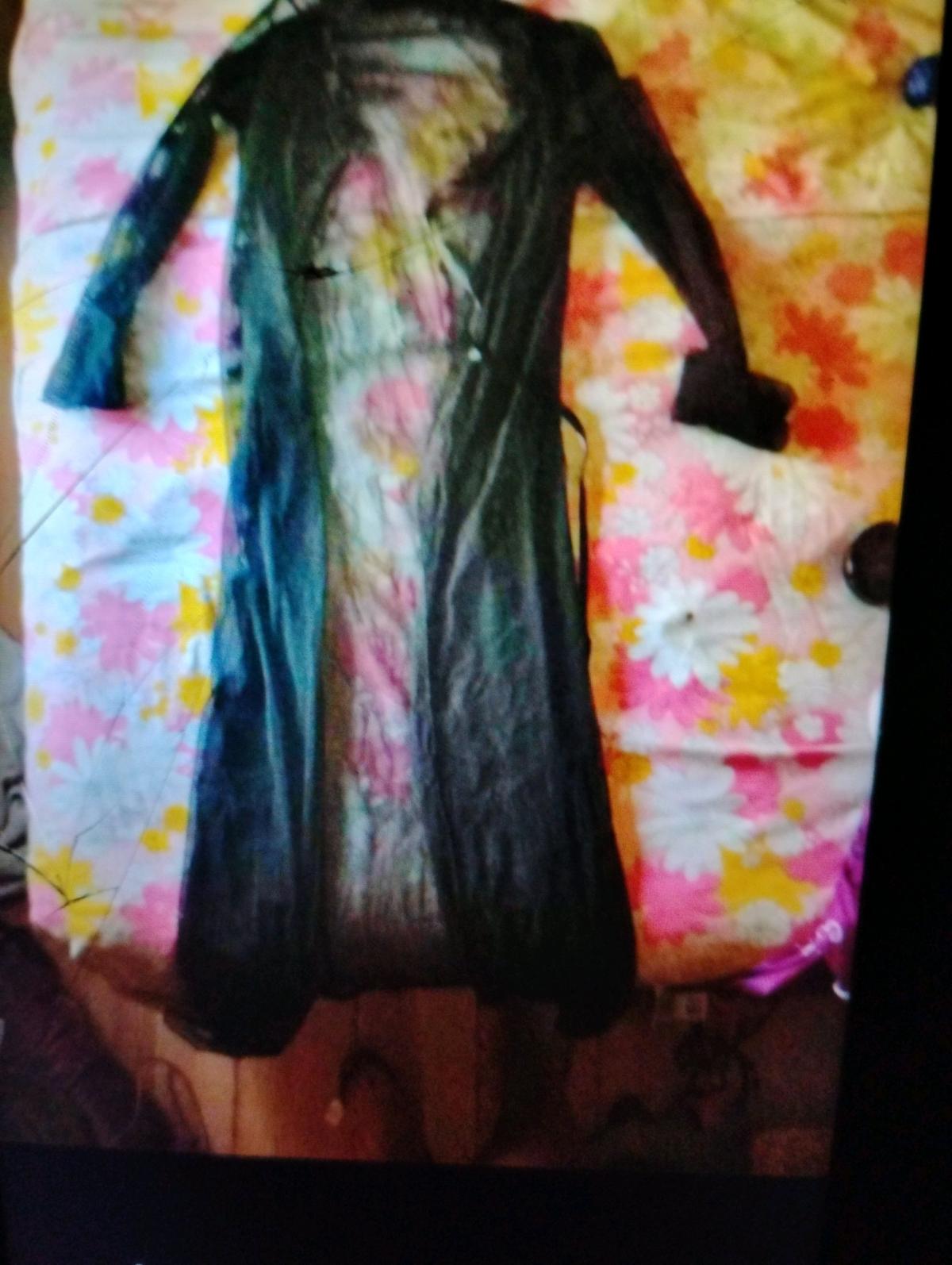 A Sexy Womans Black See Through Lingerie Robe