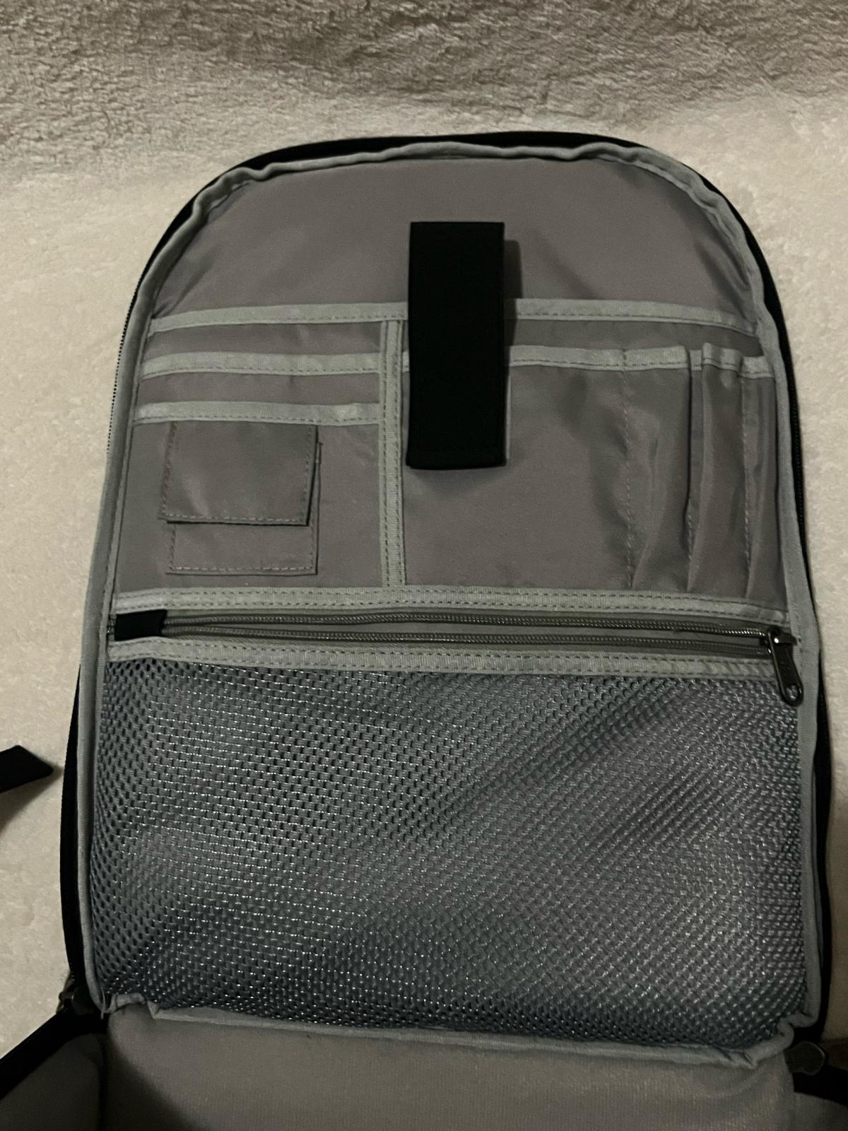 ESDDI black camera backpack with red accents and reflective