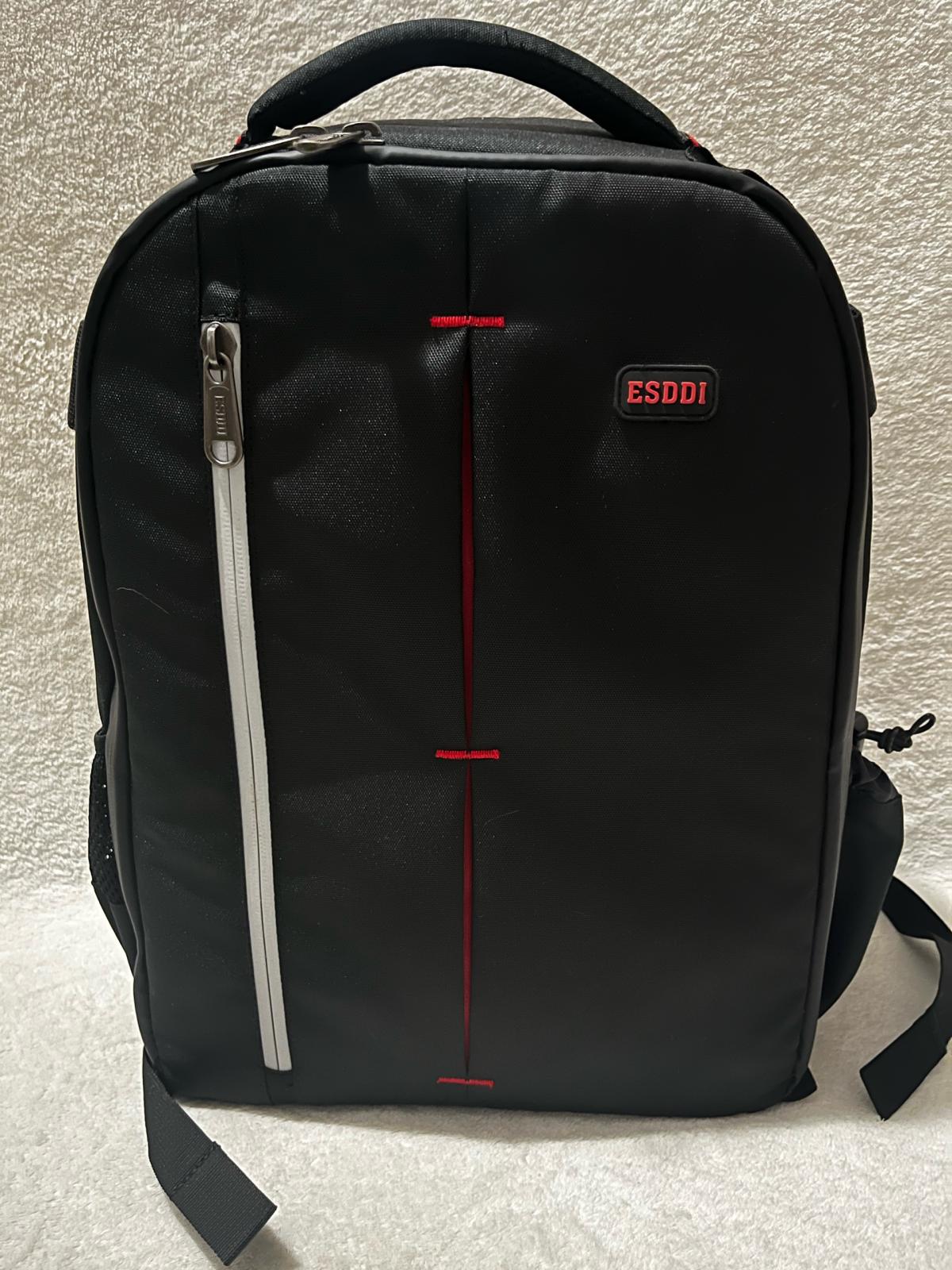 ESDDI black camera backpack with red accents and reflective