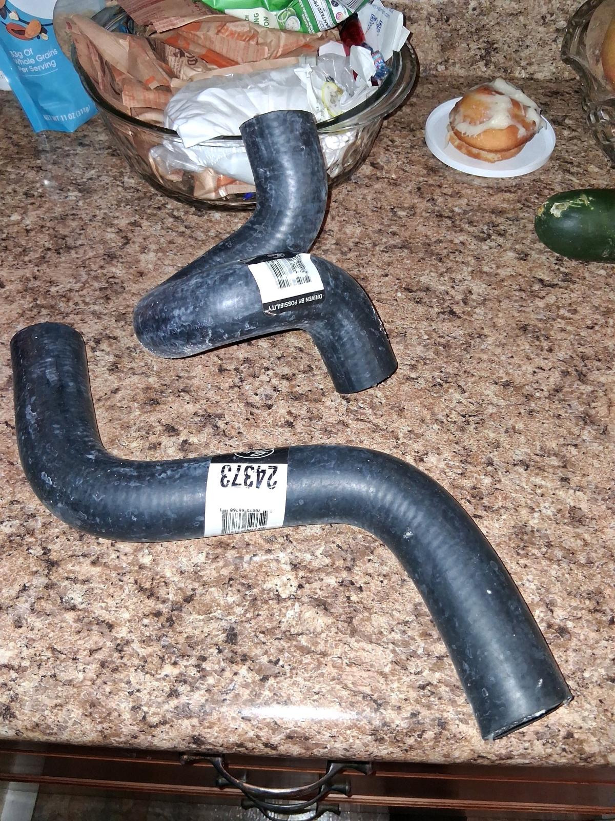 left axle and water pump hose brand new doing box never been