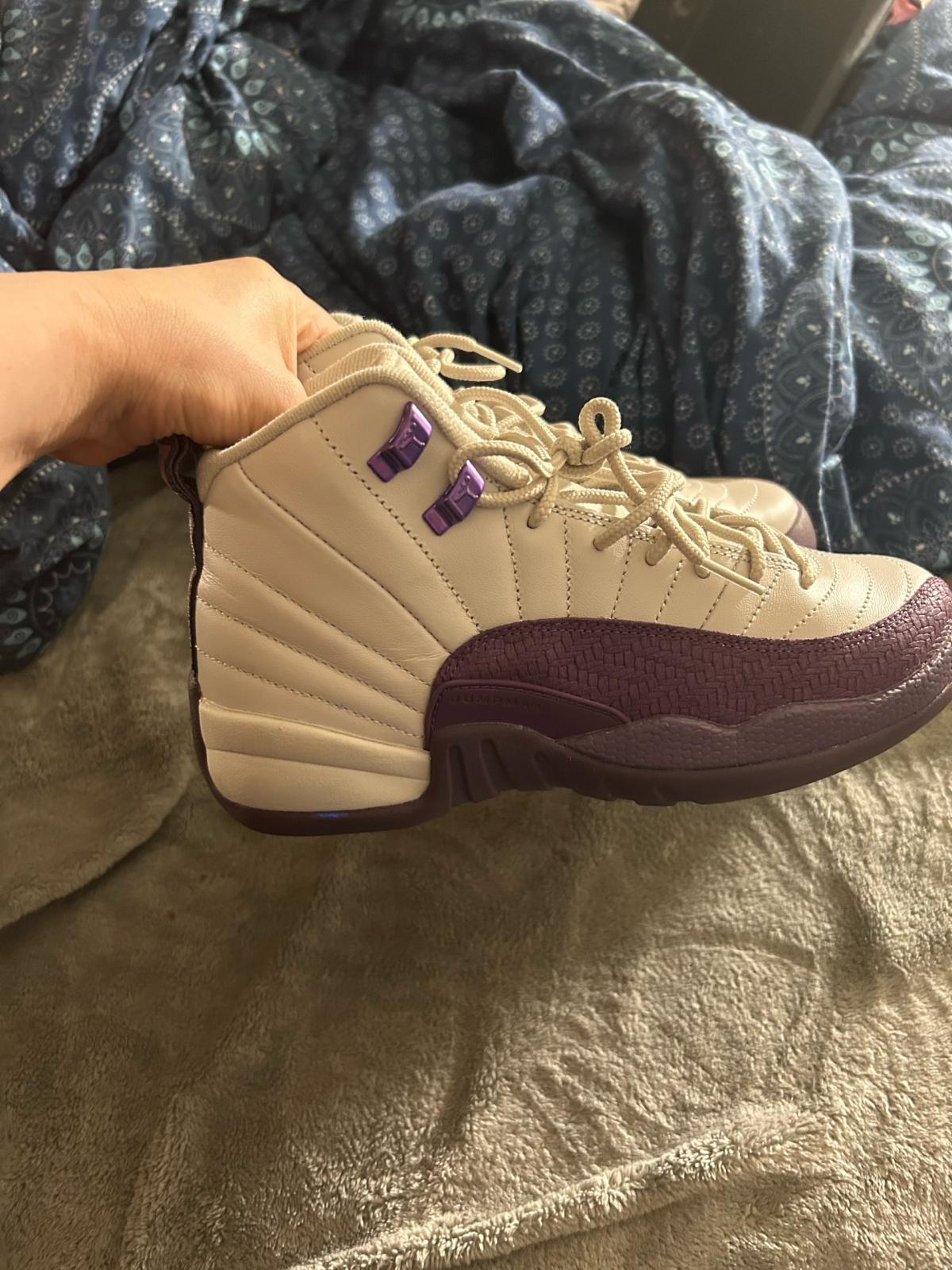 purple and white Jordans