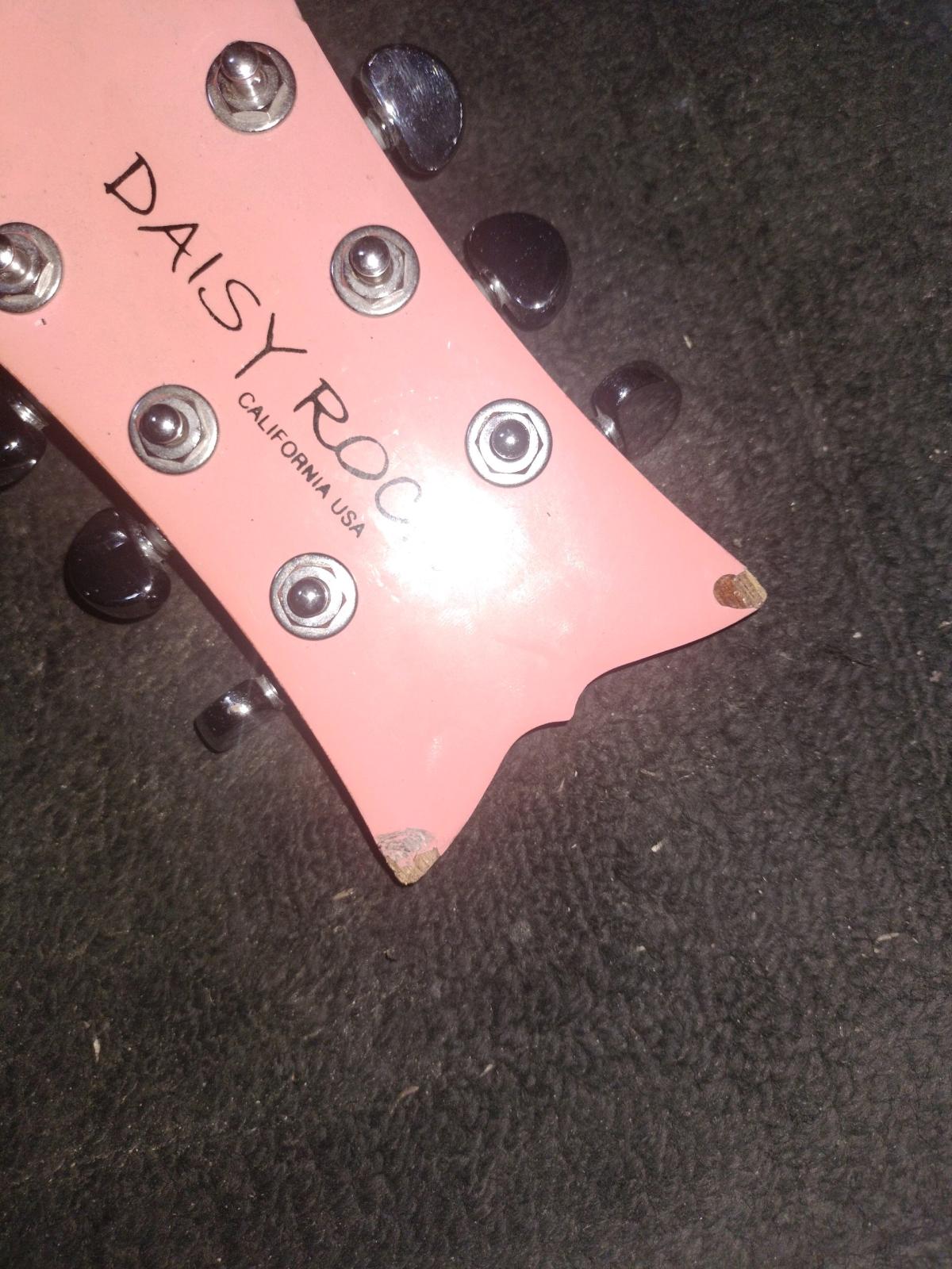 Pink daisy rock guitar