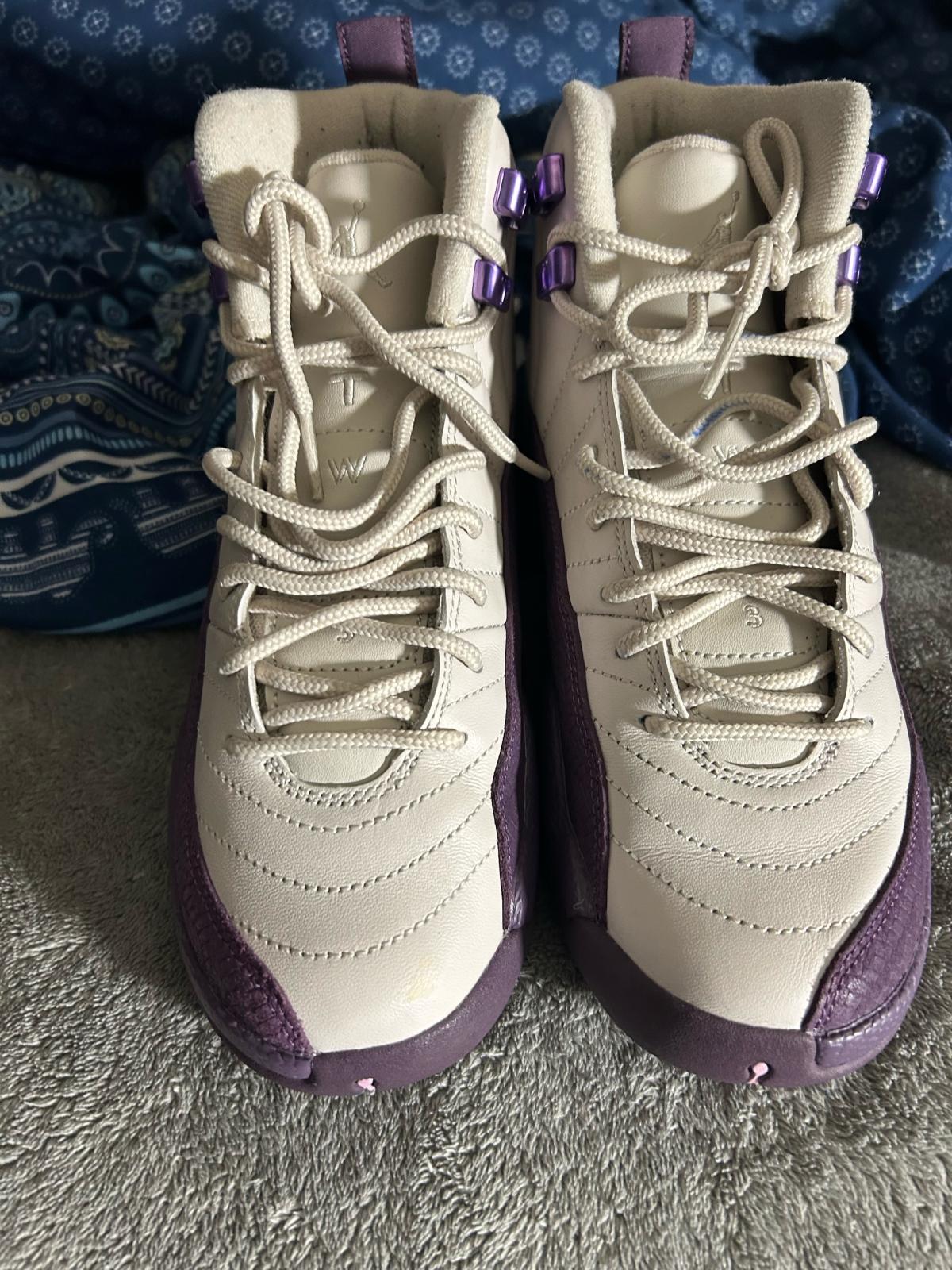 purple and white Jordans