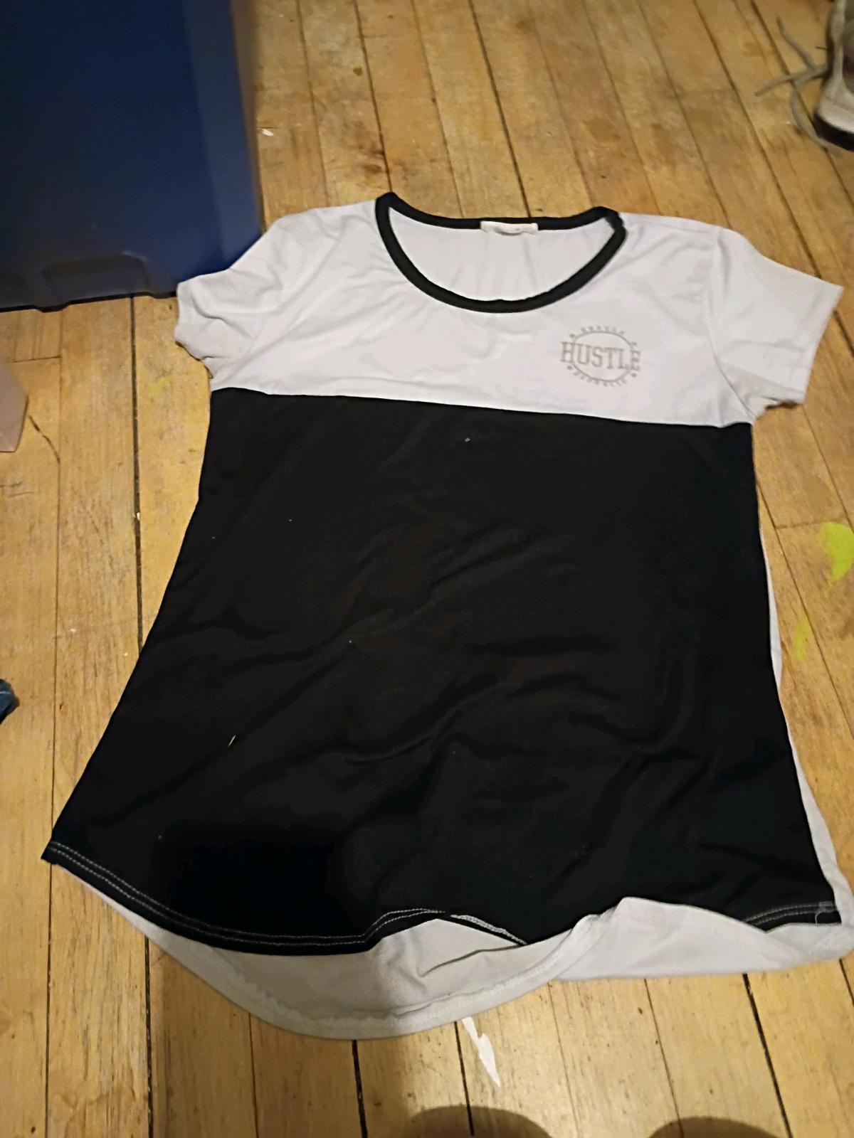 womans size L hustle shirt made of cotton