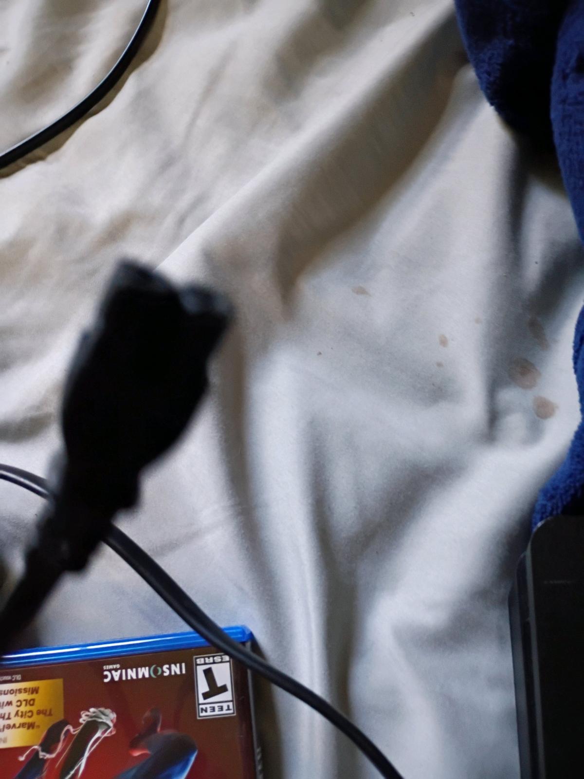 PlayStation 4 good condition used comes with chords games