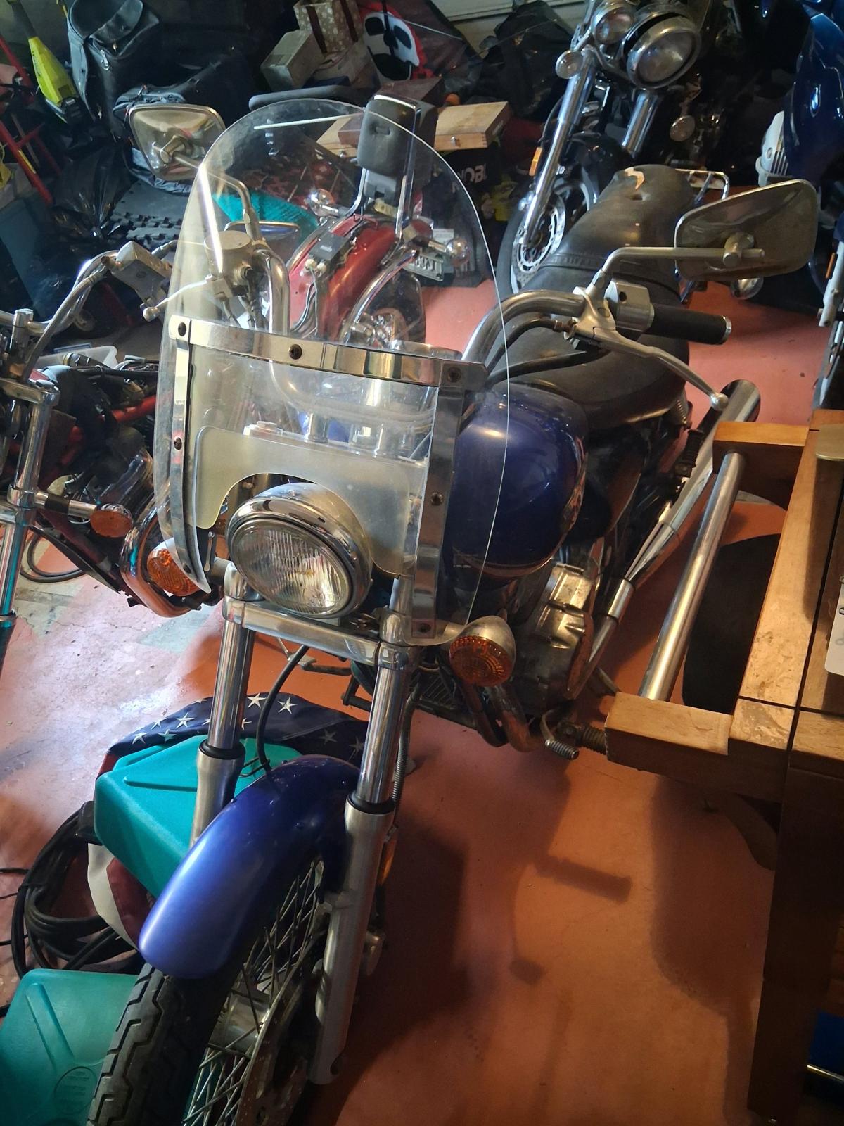motorcycles and various travel bags