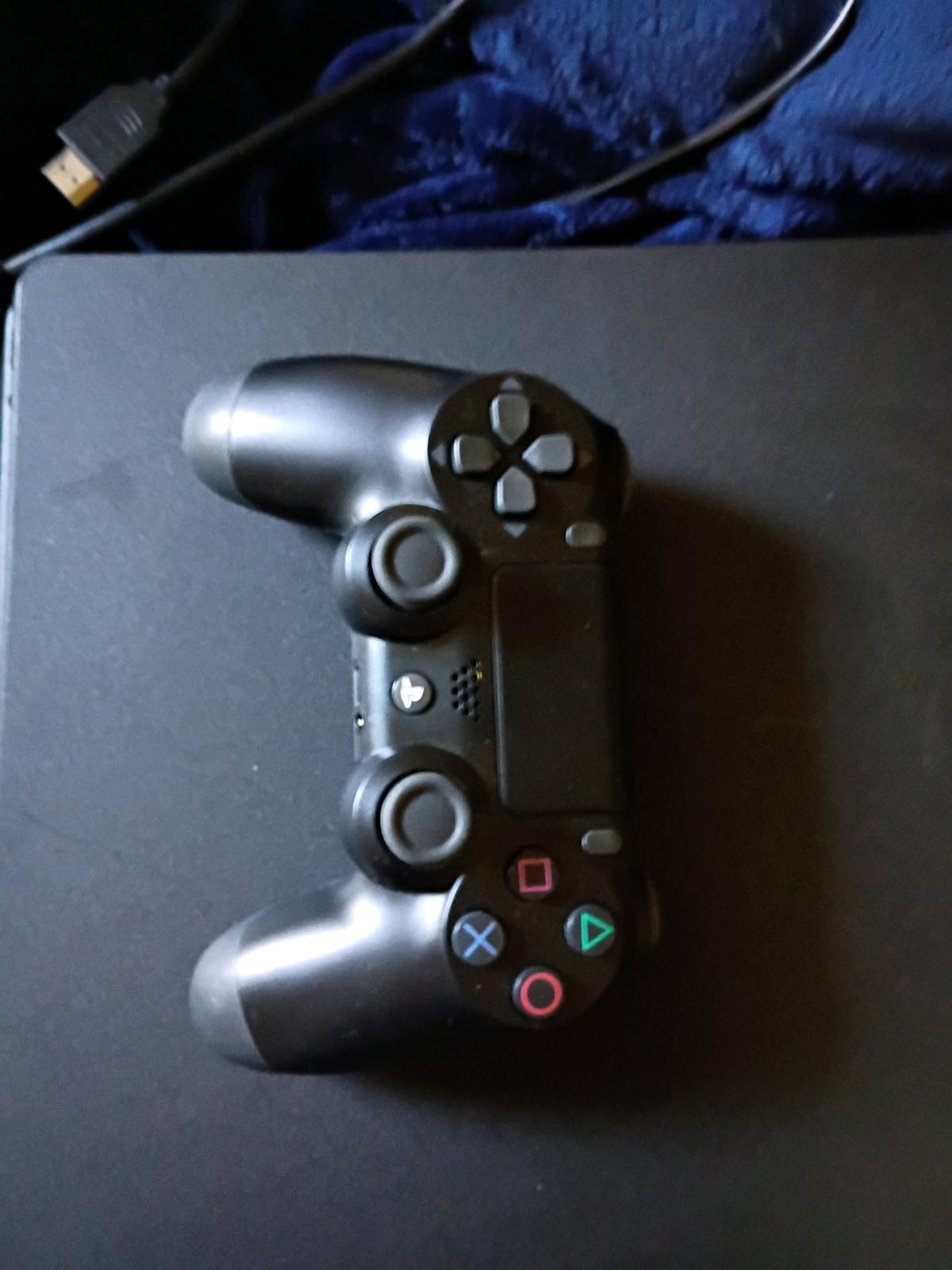 PlayStation 4 good condition used comes with chords games