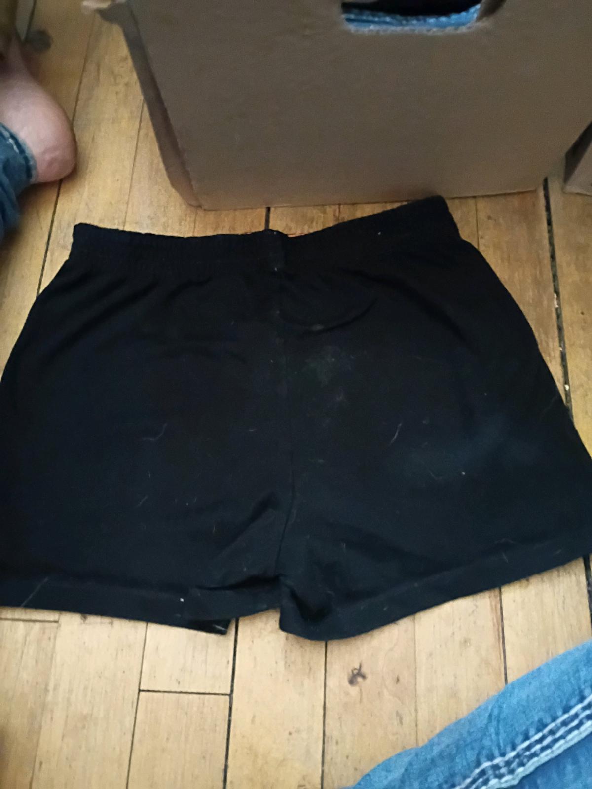 black shorts with pink waist band