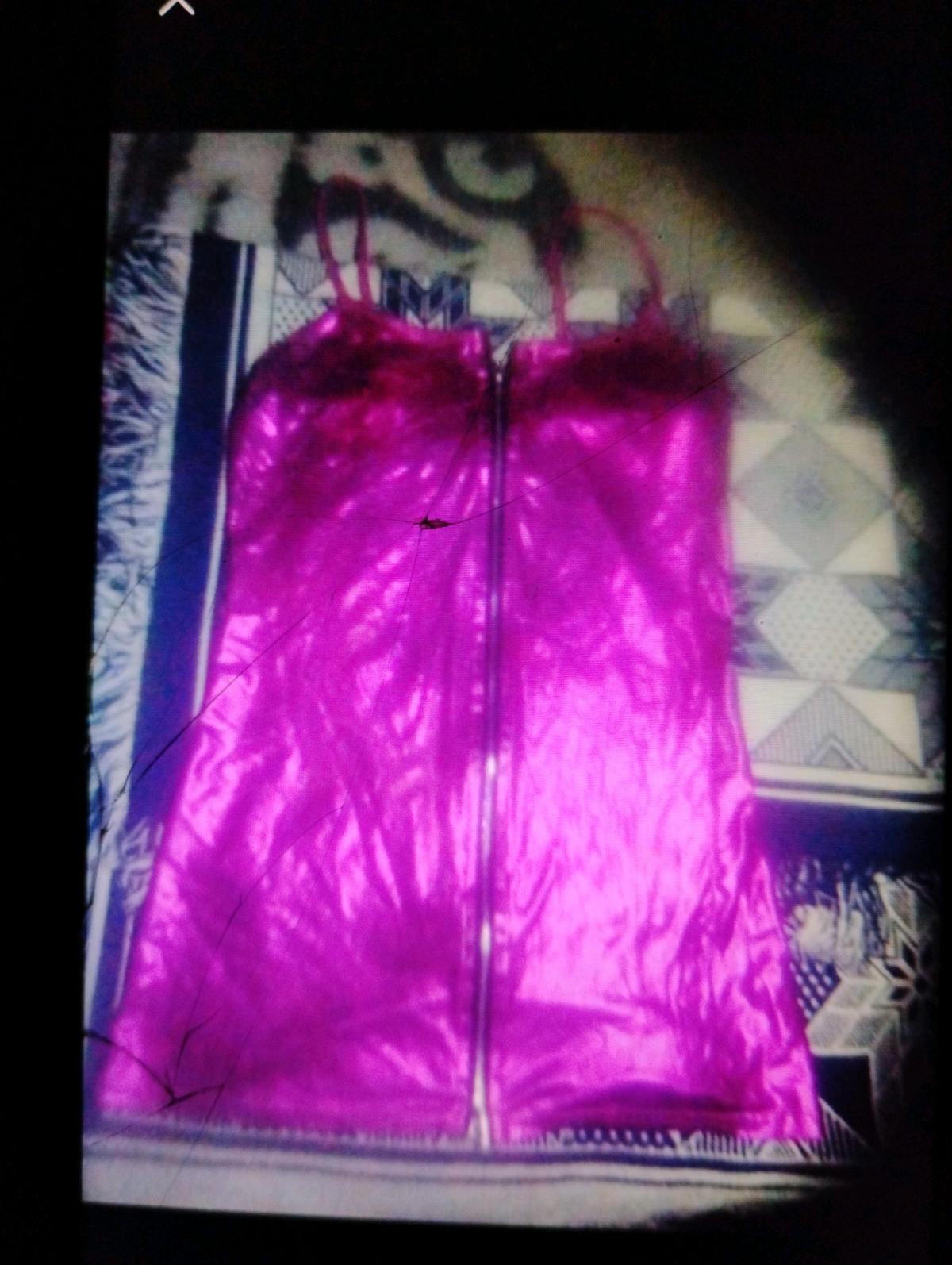 A Sexy Womans Pink Zippered Short Lingerie Outfit