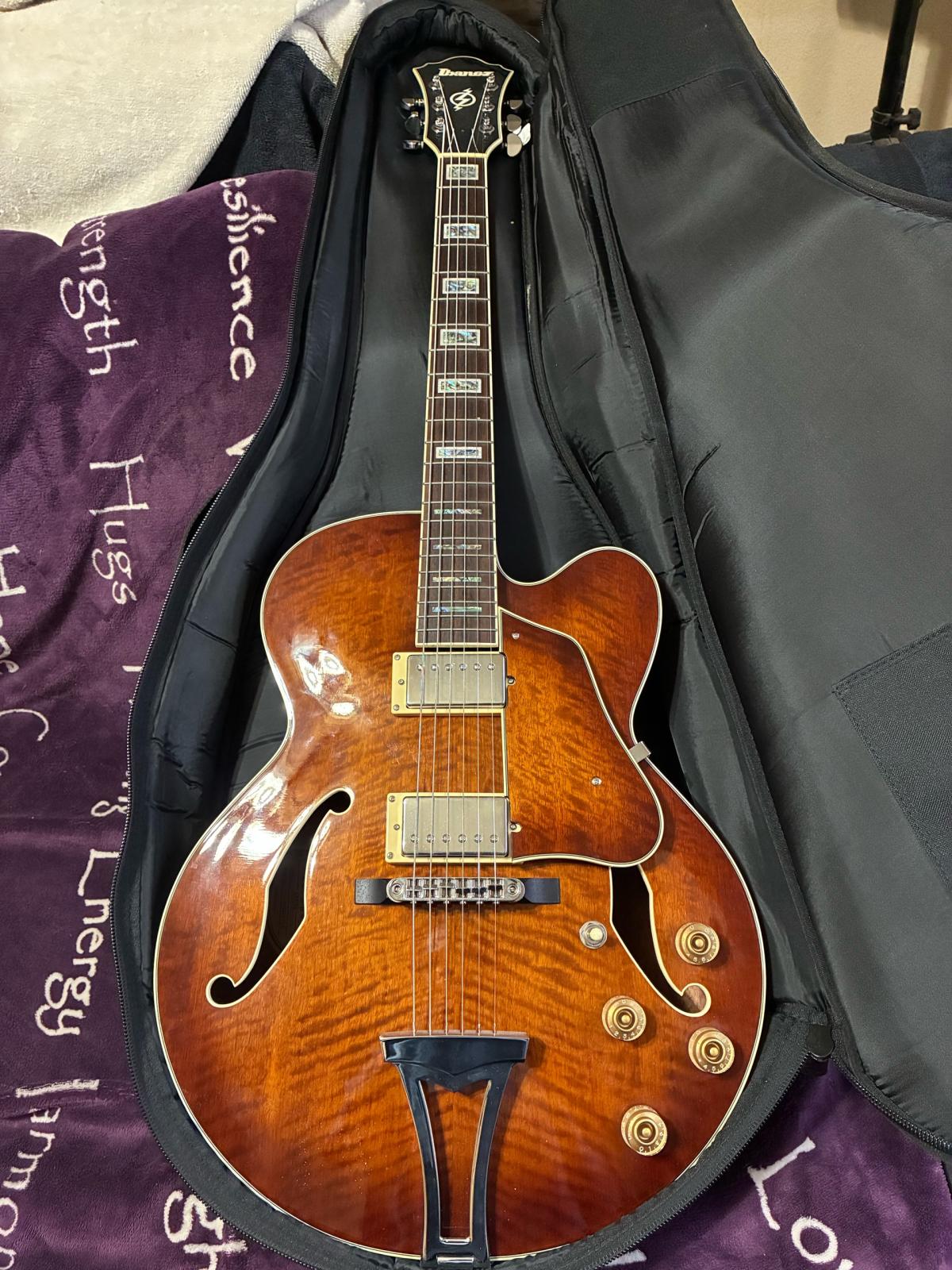 Ibanez electric guitar with case and stand and strap
