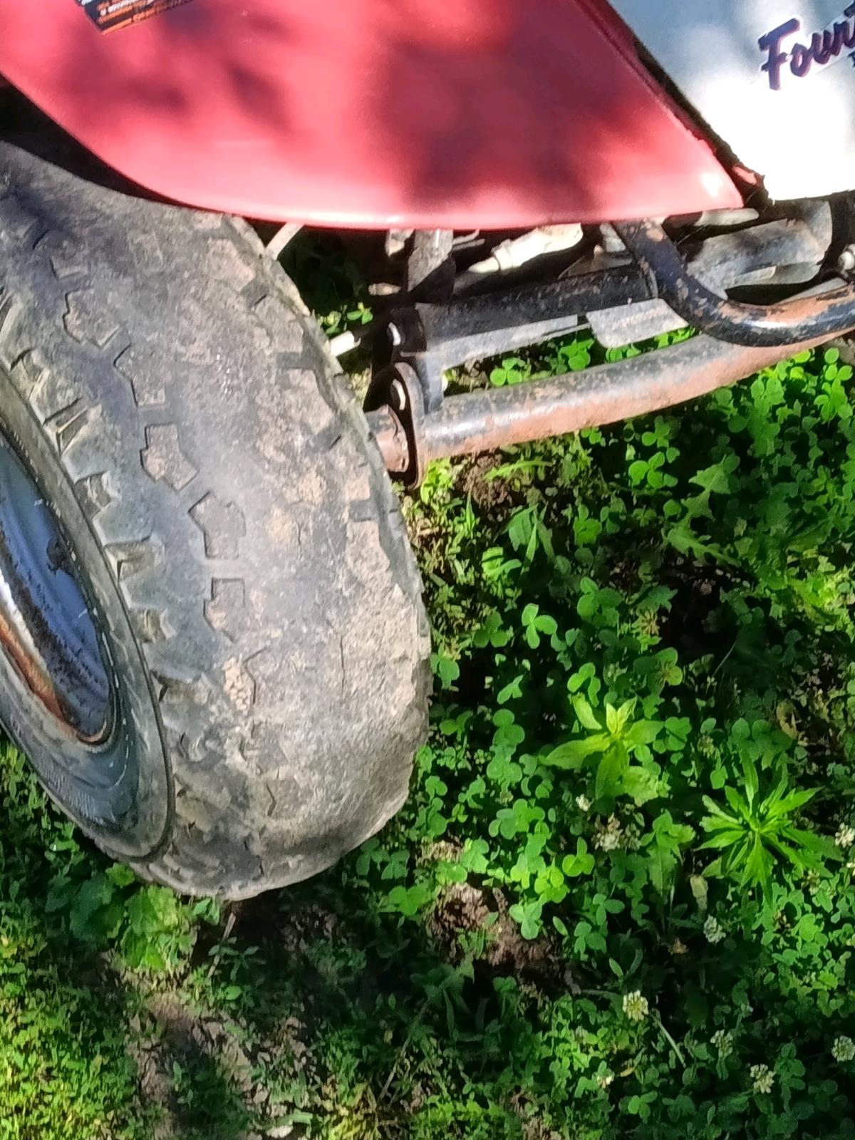 1985 red and white Honda four tax fourwheeler