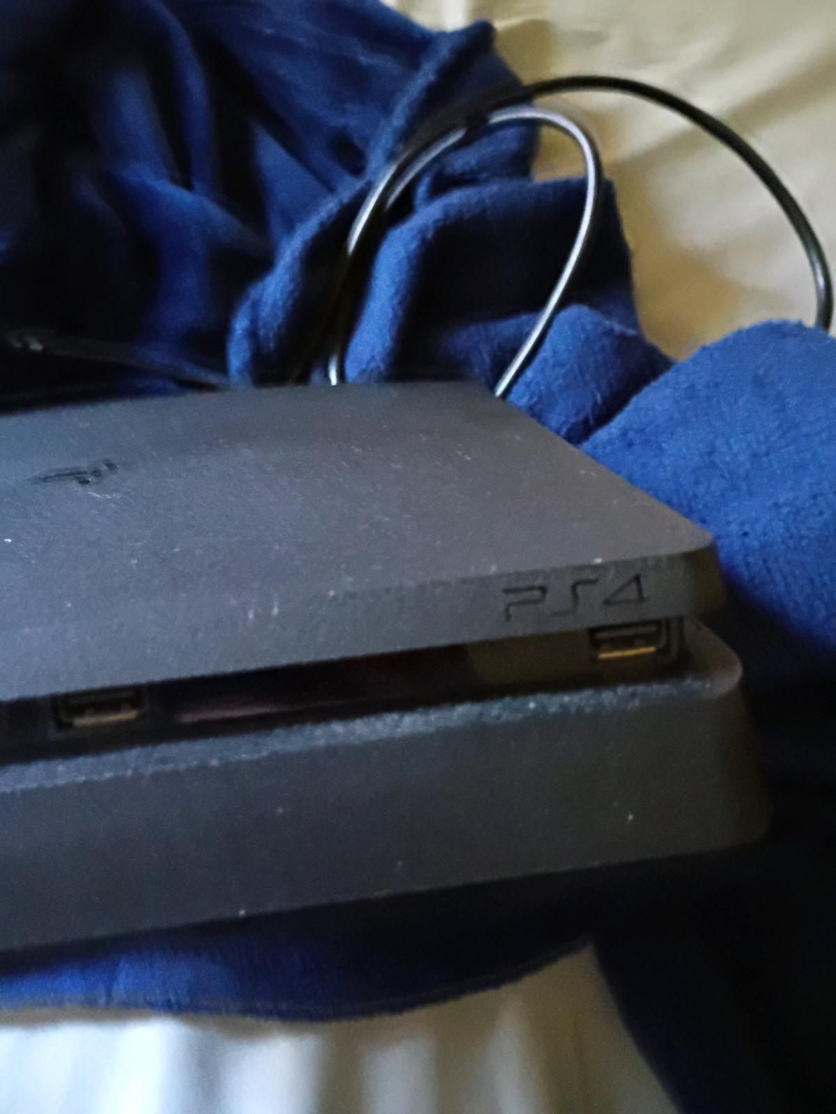 PlayStation 4 good condition used comes with chords games