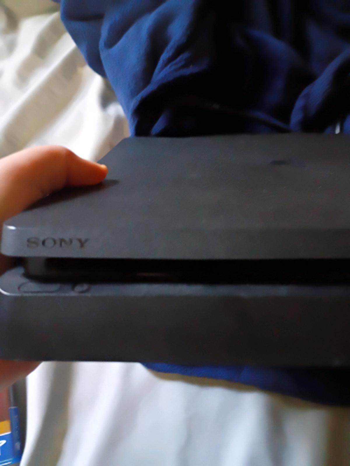 PlayStation 4 good condition used comes with chords games