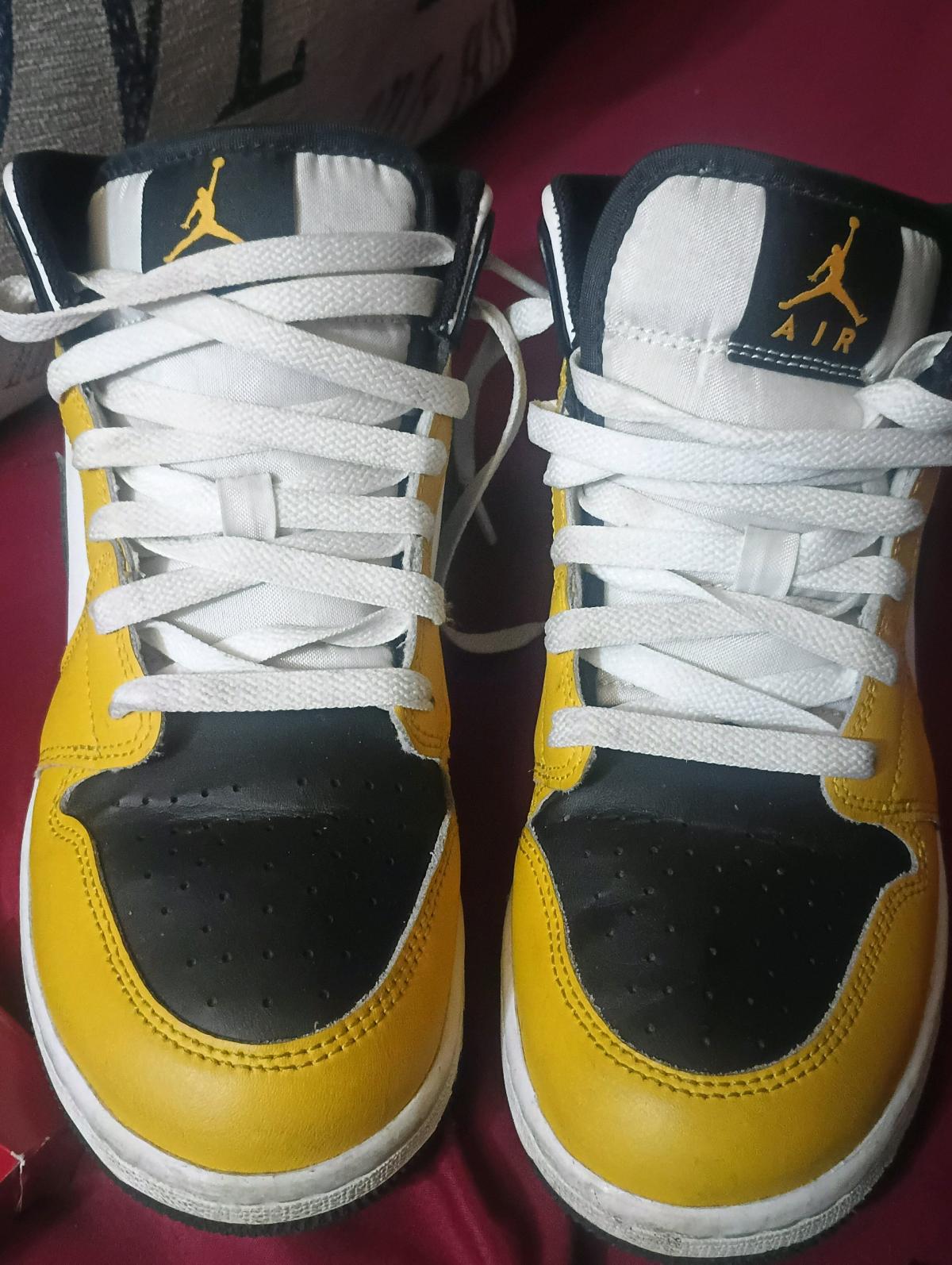 Yellow black and white Air Jordans