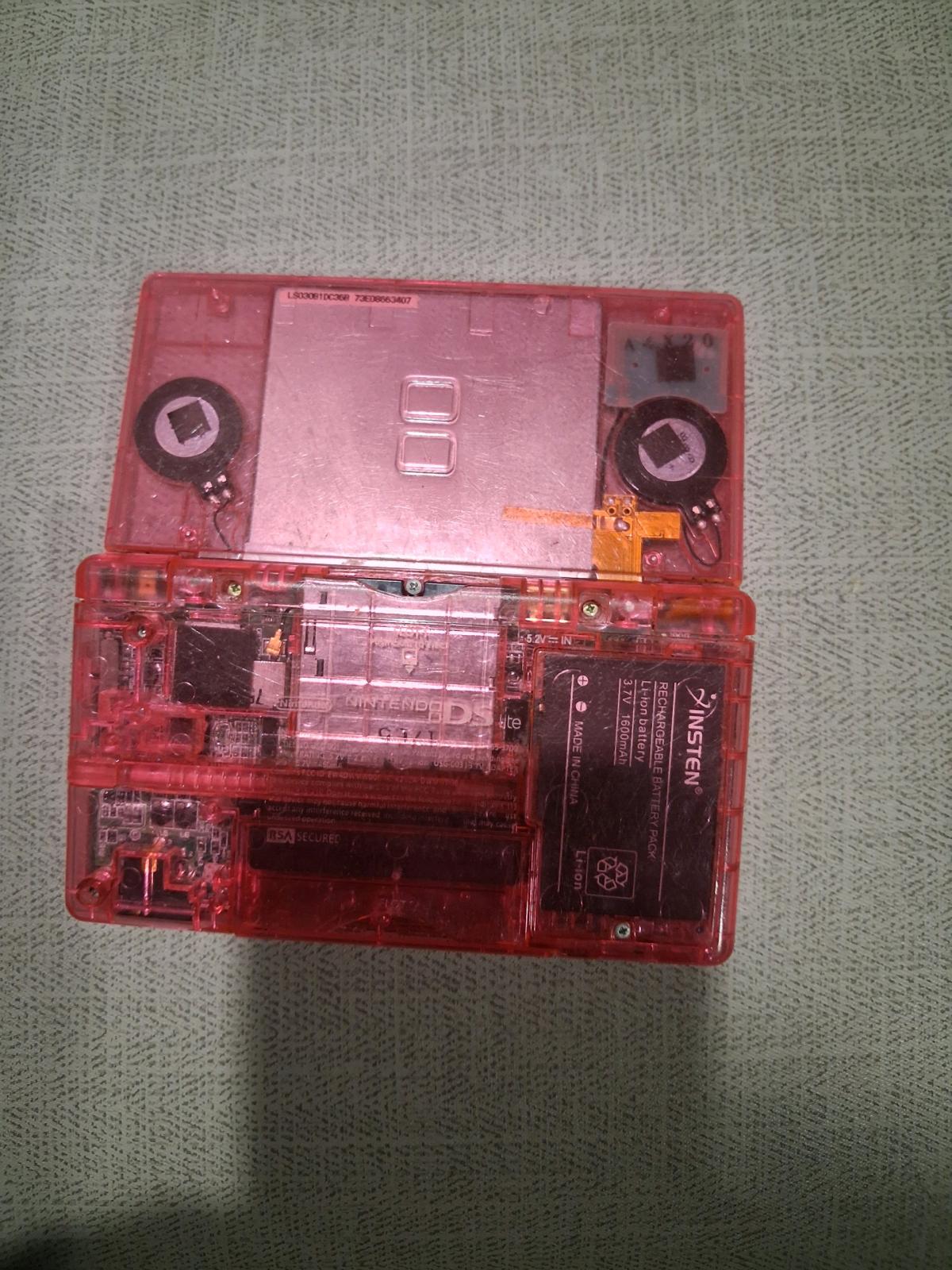 pink transparent Nintendo nes lite with 32gb memory card