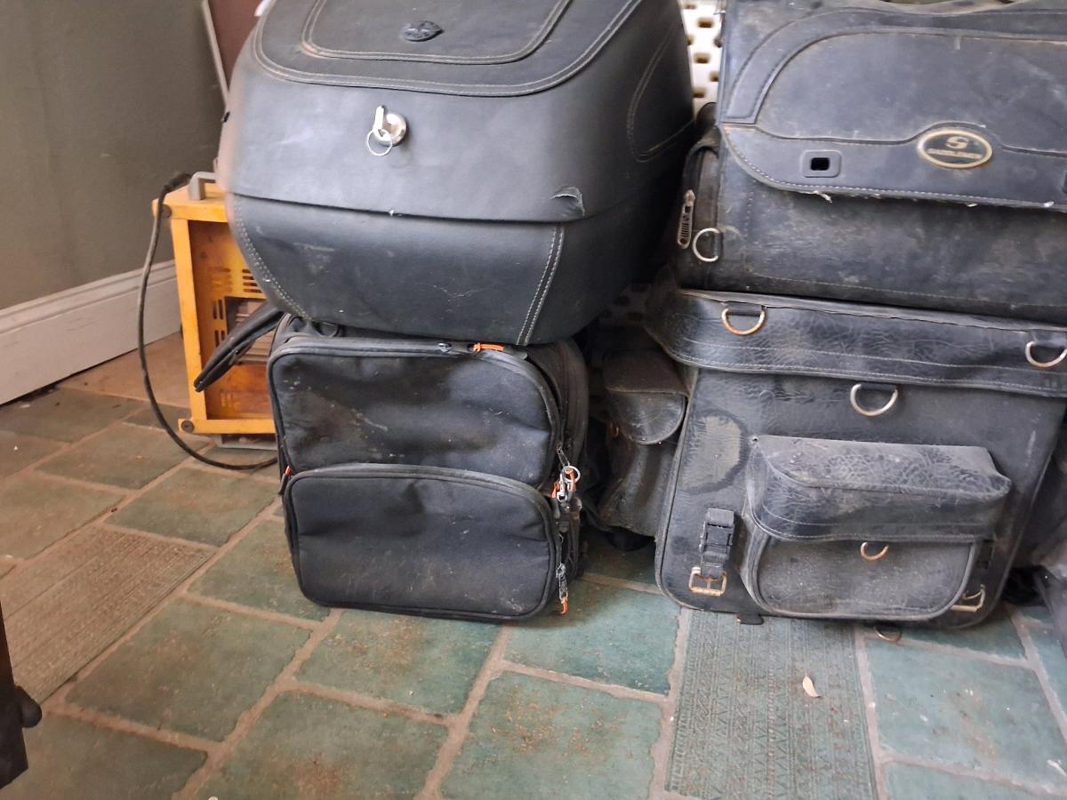 motorcycles and various travel bags