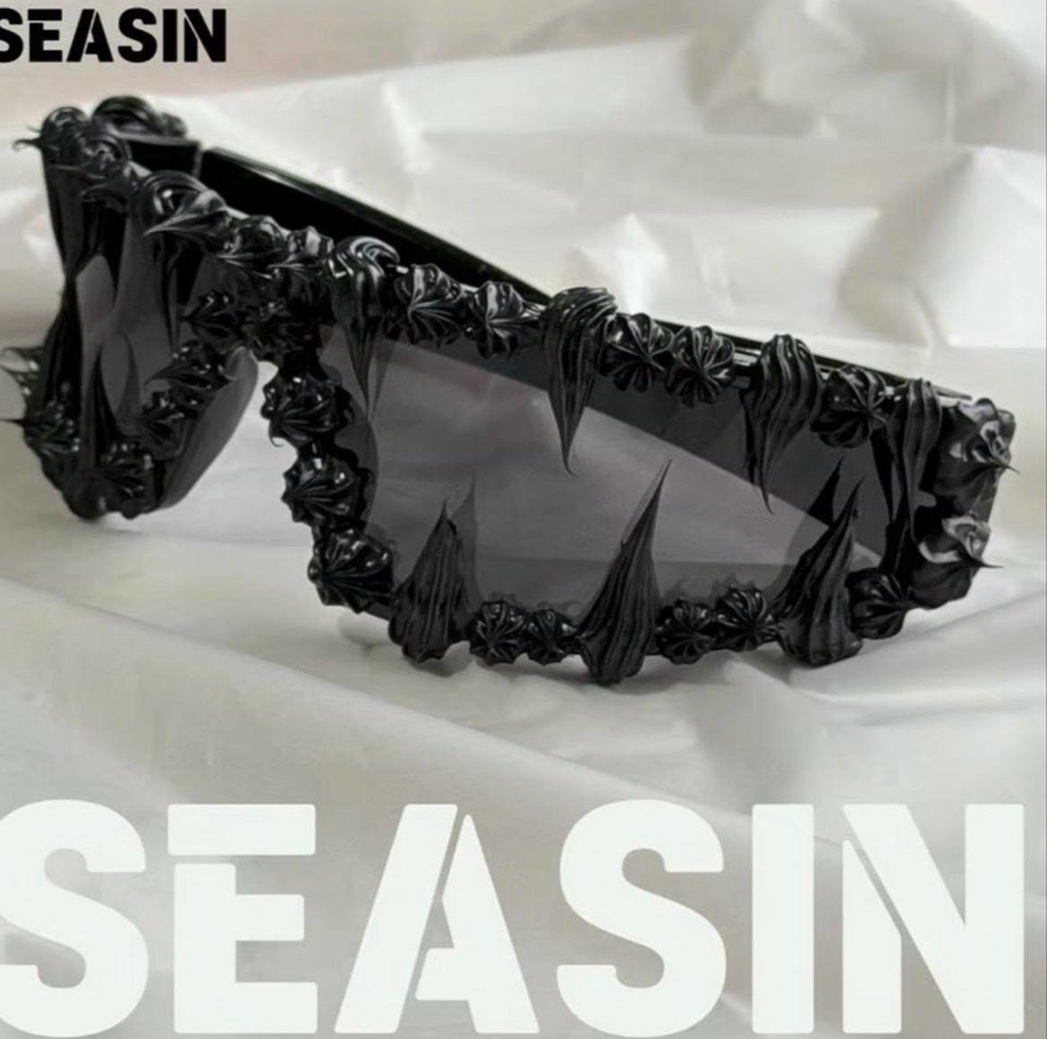 black sunglasses with black texture in the lenses