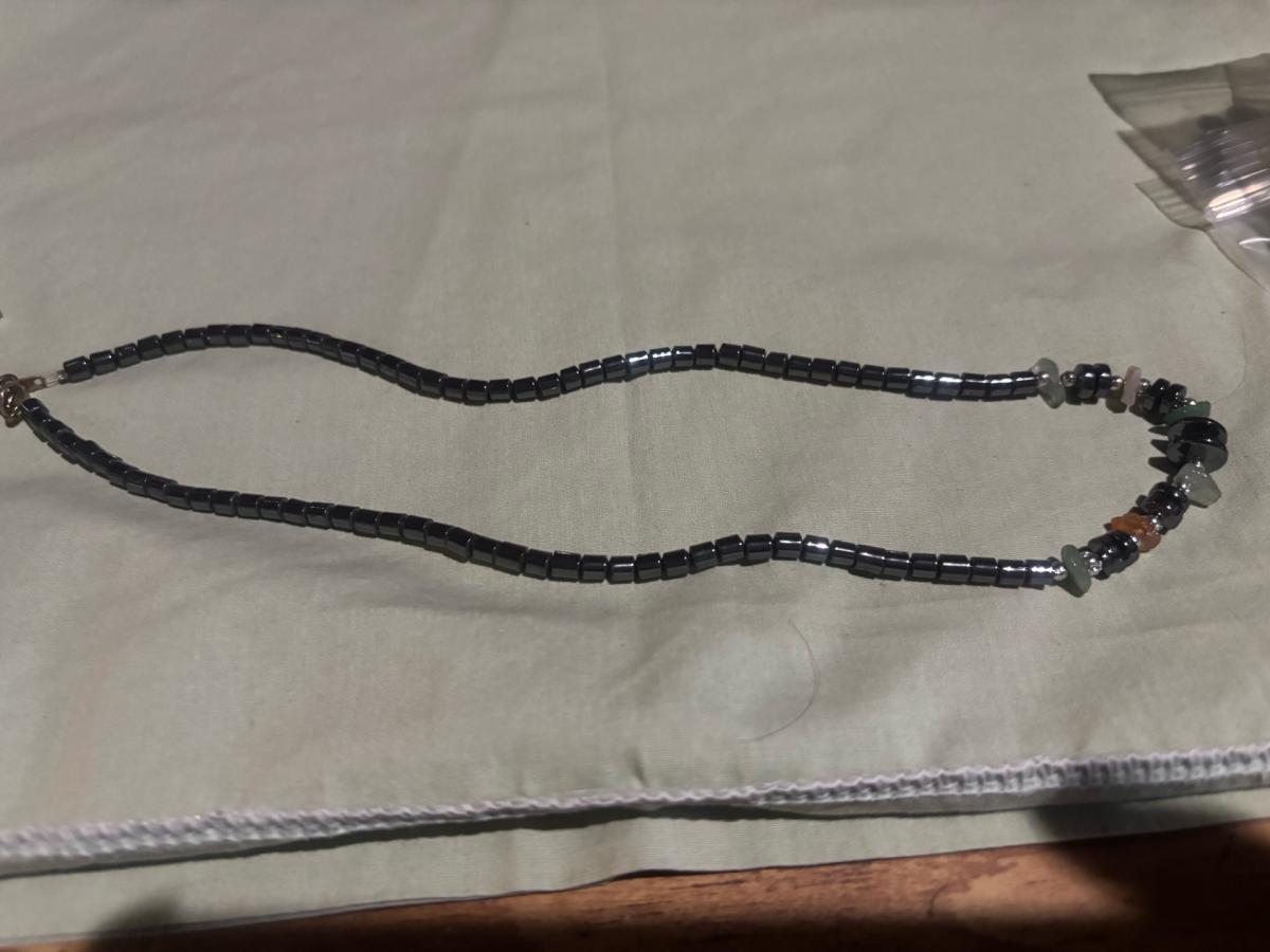 steel necklace with multicolored gemstones