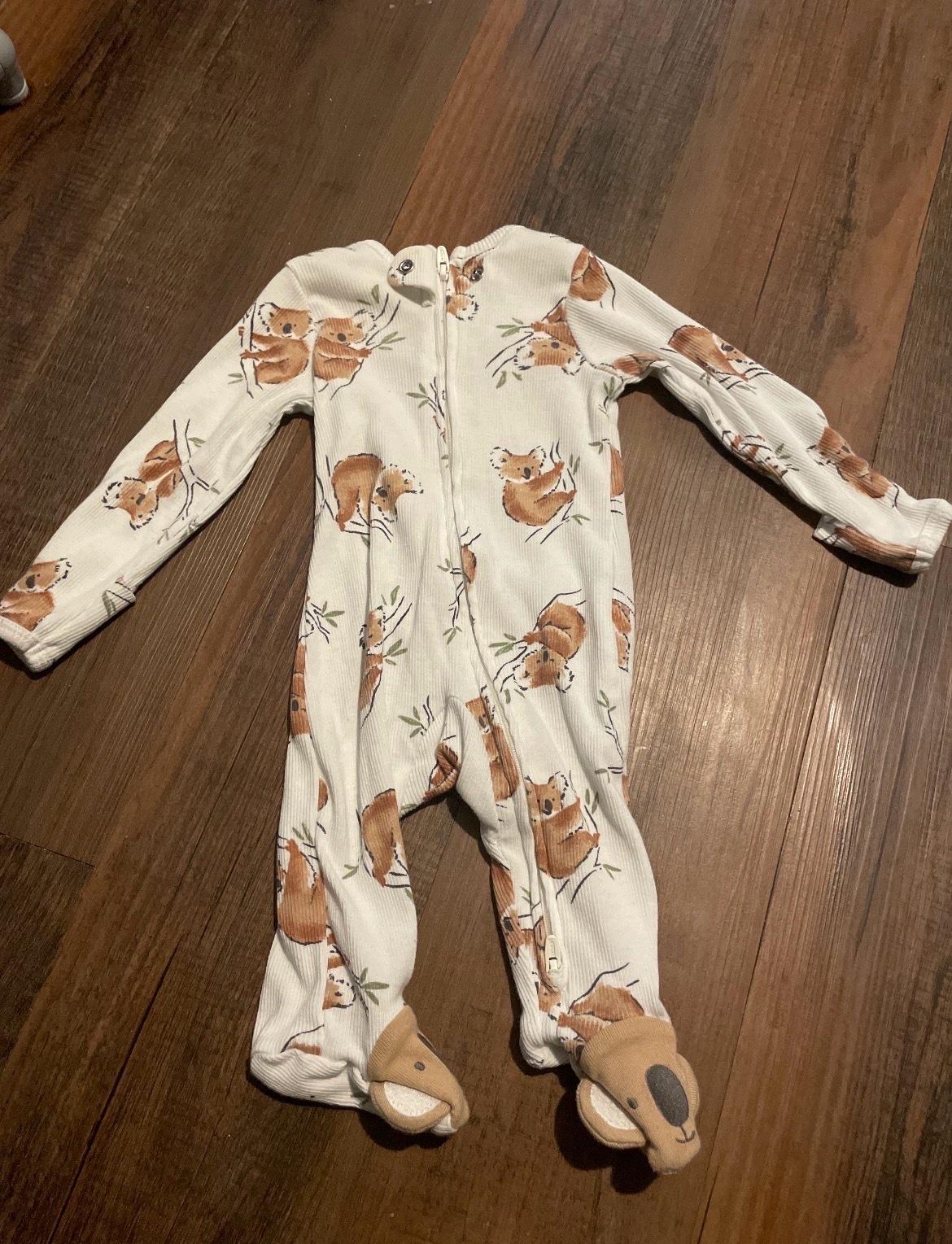 ten baby sleepers ranging in sizes 0 to 3 months